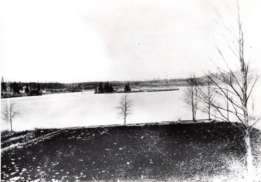 About 1927. View of Lake Ballinger from 205th Street. A view of Lake Ballinger taken about 1927 looking north from what is today 205th St. The island and its house owned by Richard Ballinger, a former law partner of Judge Ronald. Photo provided by th