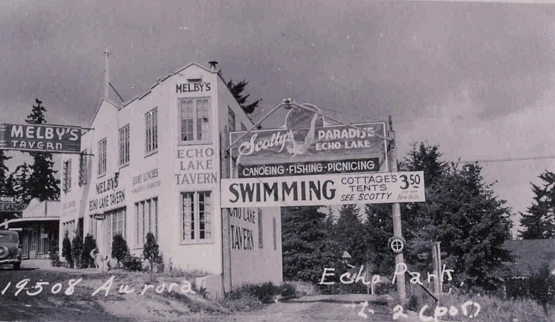 1937. Echo Lake Tavern on Aurora Avenue
1937. Melby's Echo Lake Tavern at 19508 Aurora Avenue. The signs advertise Scotty's Paradise Echo Lake which is reached by this unpaved road named Echo Lake Place. Photo courtesy of the Washington State Archive