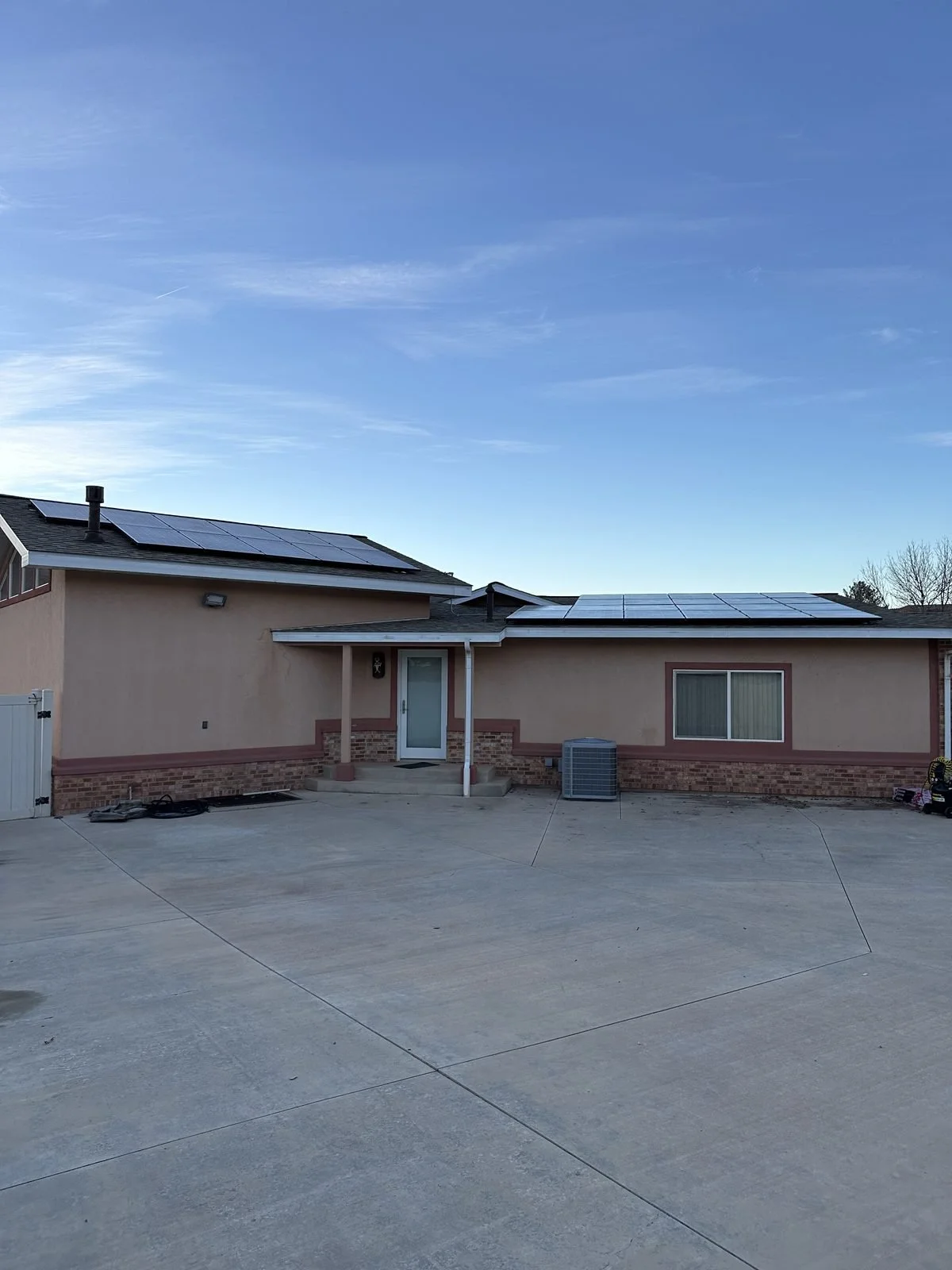 Home with rooftop solar panels installed by Genesis Solar in Utah