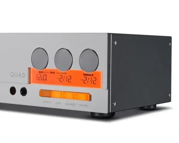 Close-up of the Quad 33 preamplifier showing the illuminated display, headphone jack, dedicated Bass, Tilt and Balance controls, and front-panel function buttons.