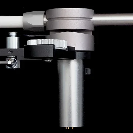 Close-up of the Korf tonearm bearing assembly, mounting shaft, and arm tube.
