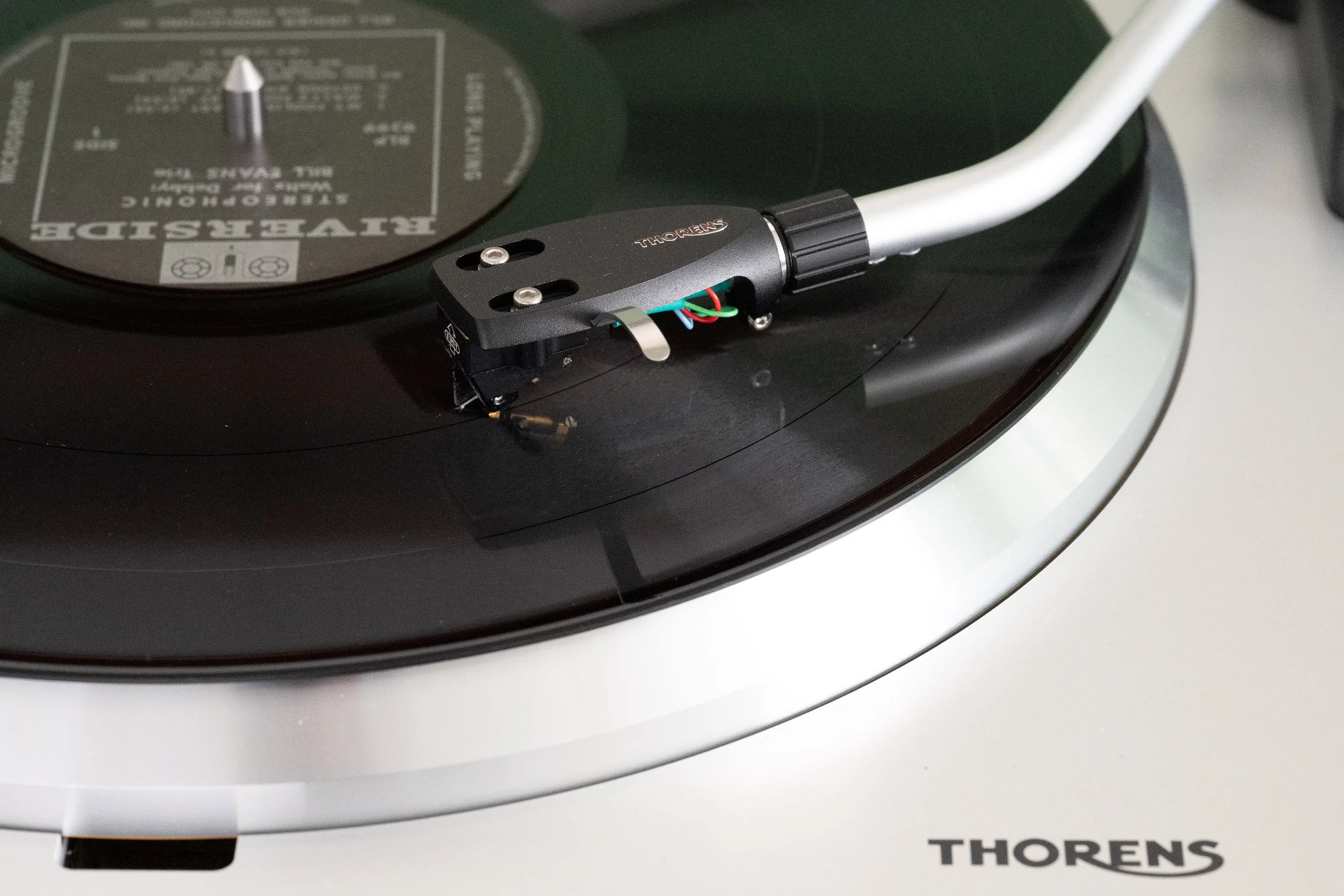Detail of Waltz for Debby record playing on a Thorens TD 404 with the tonearm projecting in from the right.