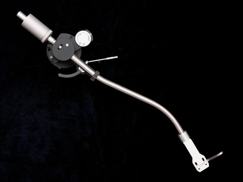 Korf TA-SF11R tonearm with curved steel arm tube, flexure bearing assembly, and detachable headshell shown in three-quarter view against a black background.