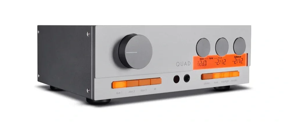 Three-quarter front view of the Quad 33 preamplifier in silver, showing its precision volume control, illuminated display and distinctive industrial design.