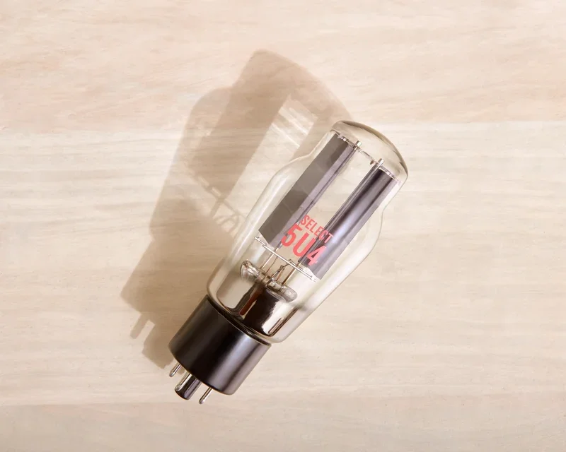 Overhead view of a Ray Tubes SELECT 5U4 laying on its side against a light background.