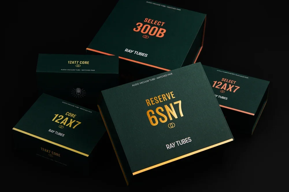 Beauty shot showing an assortment of Ray Tubes boxes in green with orange lettering.