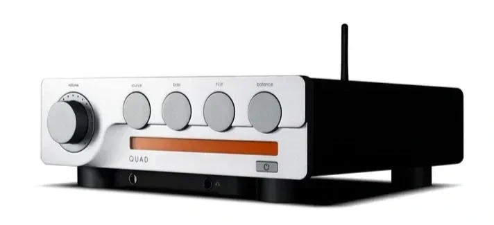 Three-quarter front view of the Quad 3 integrated amplifier in silver, showing its volume, source selection bass, tilt and balance controls, front-panel display and clean industrial design.