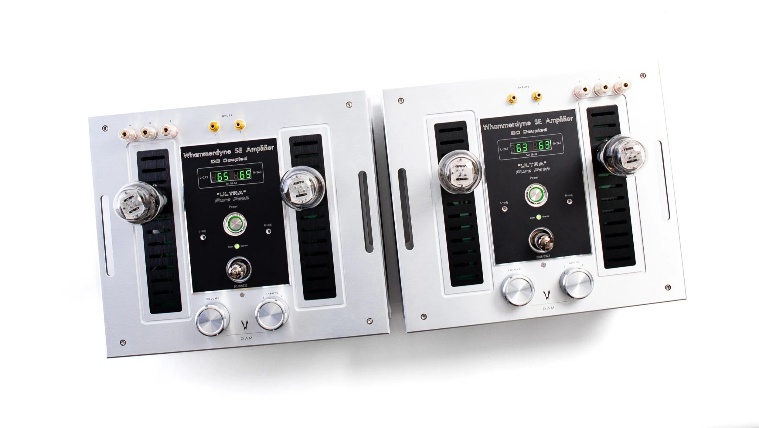 Whammerdyne Dam Awesome Mono mono amplifiers, pair shown from the top with brushed aluminum top plate, black accents, central control panels with green bias displays and exposed vacuum tubes on each unit.