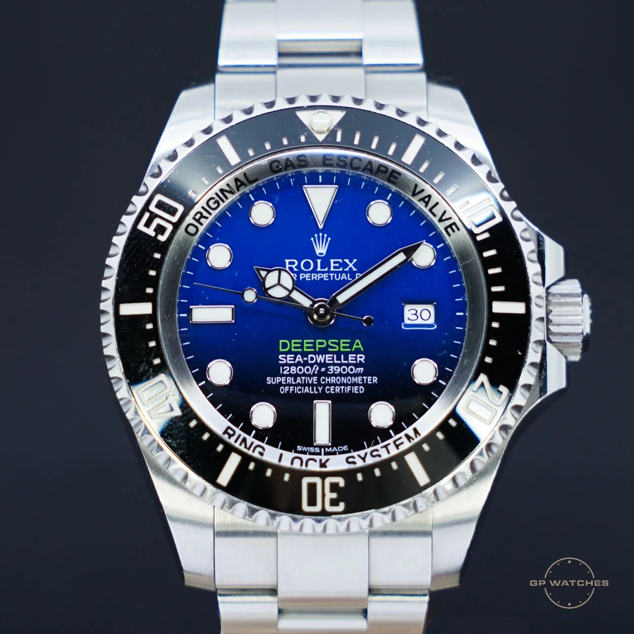 A Rolex Deepsea Sea-Dweller wristwatch with a blue dial, stainless steel band, and black and silver bezel, displaying the date and time.