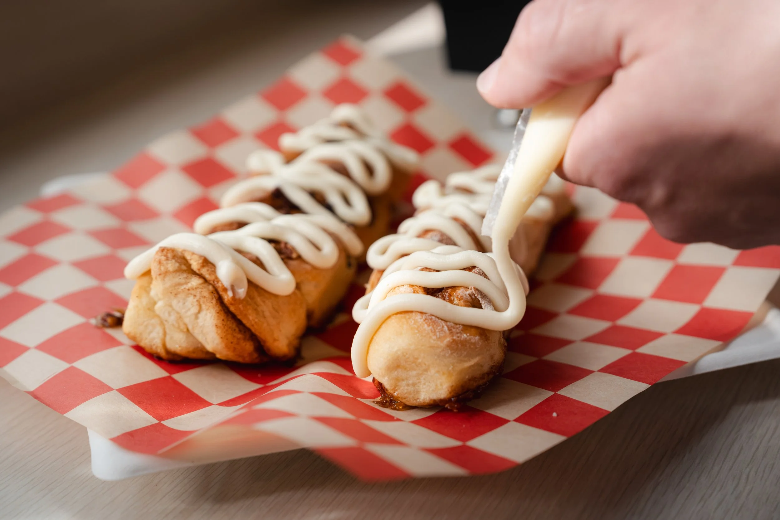 Icing piped onto a fresh pastry, detail from a commercial food shoot in Bigfork, Montana.