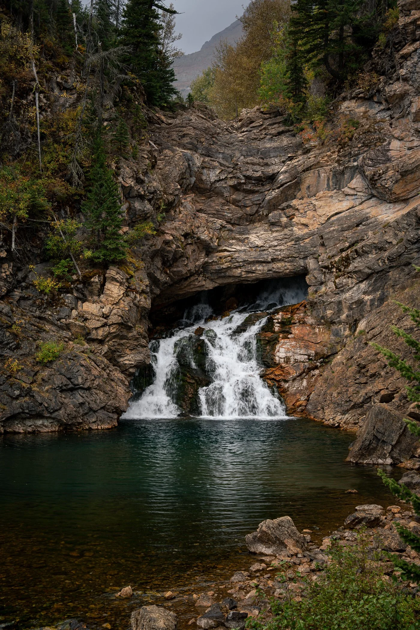 Running eagle falls in two medicine glacier National Park in the fall