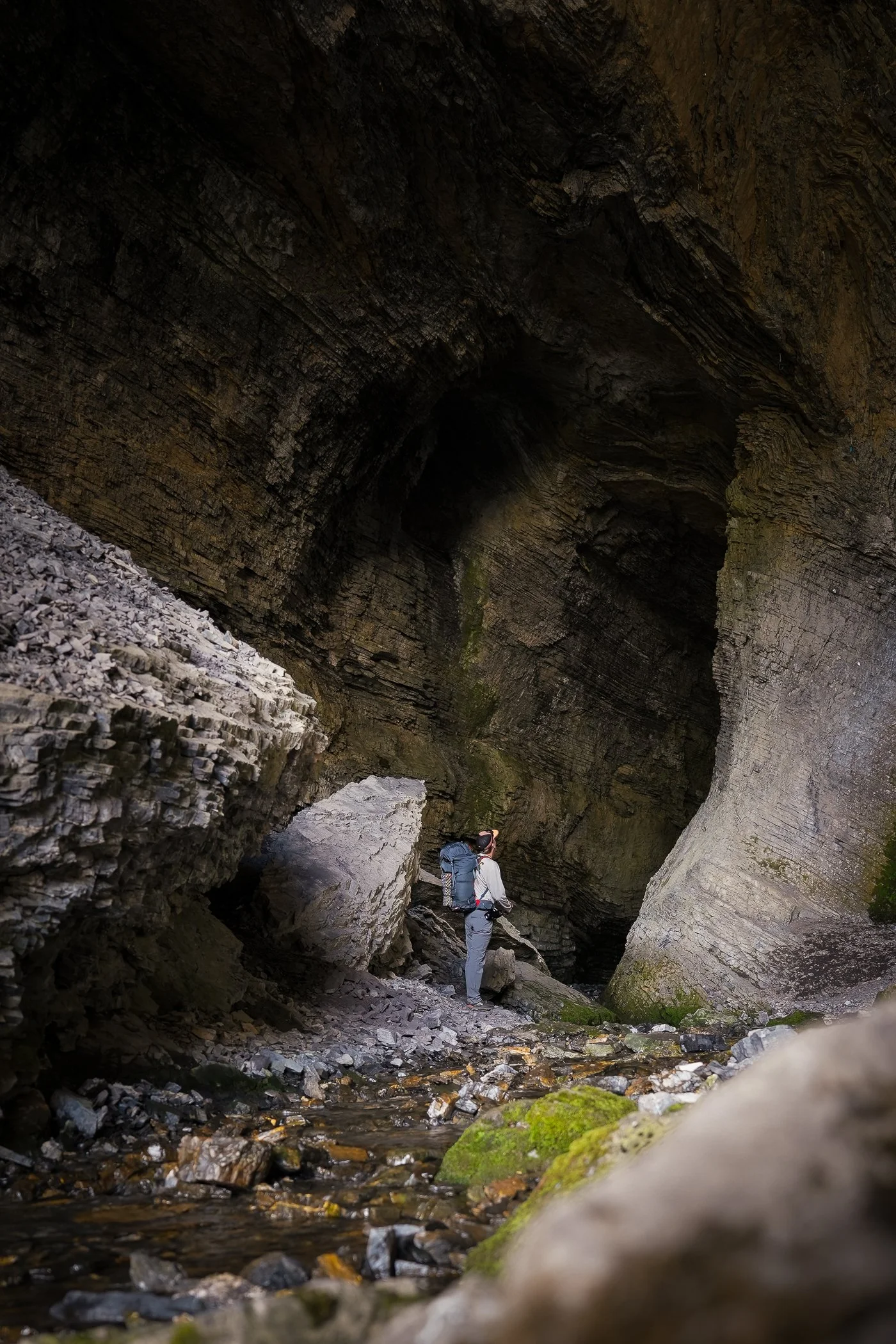 backpacker in cave in British Columbia