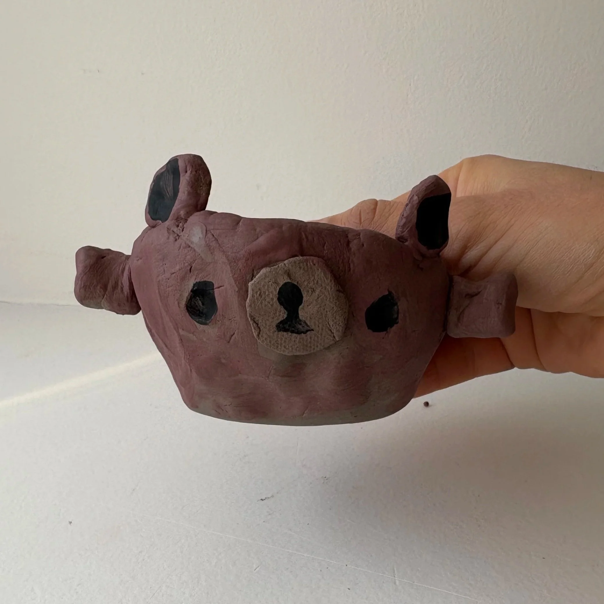 Ceramic teddy bear mug crafted by a child