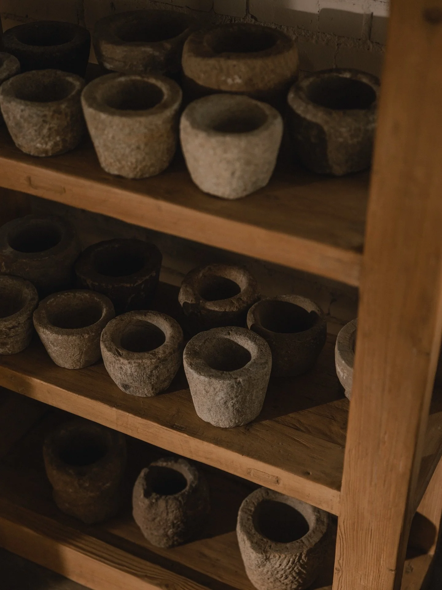 A study in texture. Hand-carved stone bowls, softened by time and use. No two are the same.