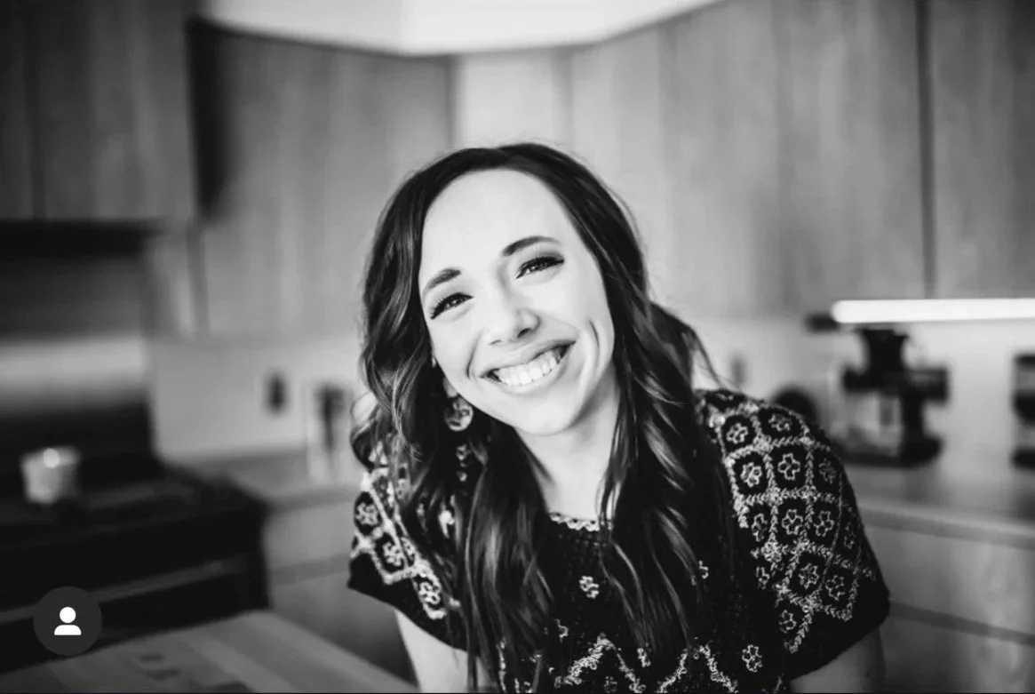 Brunette stylist smiling