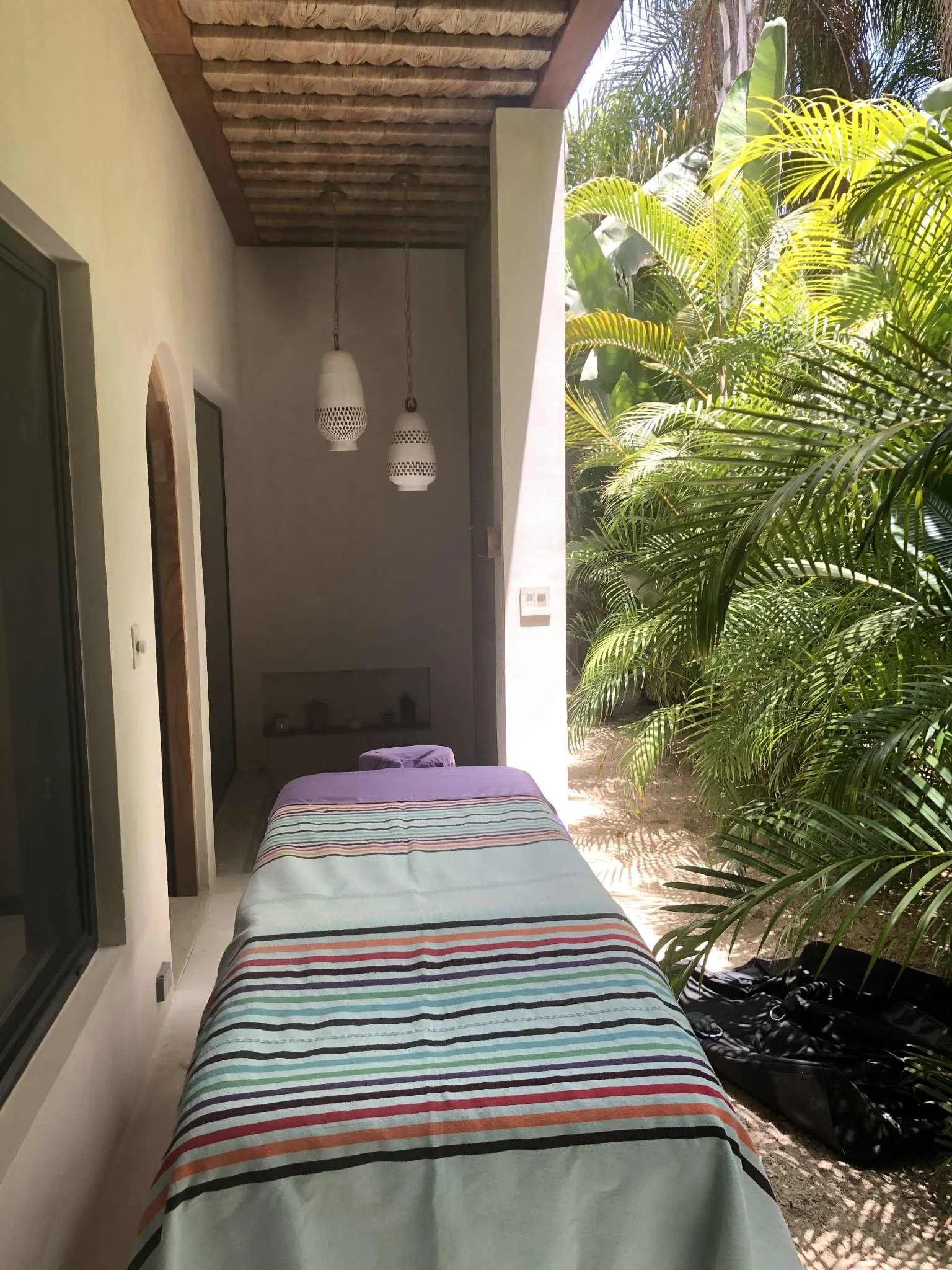 “Massage table set up on a private patio in El Pescadero for relaxing in-home massage session.”