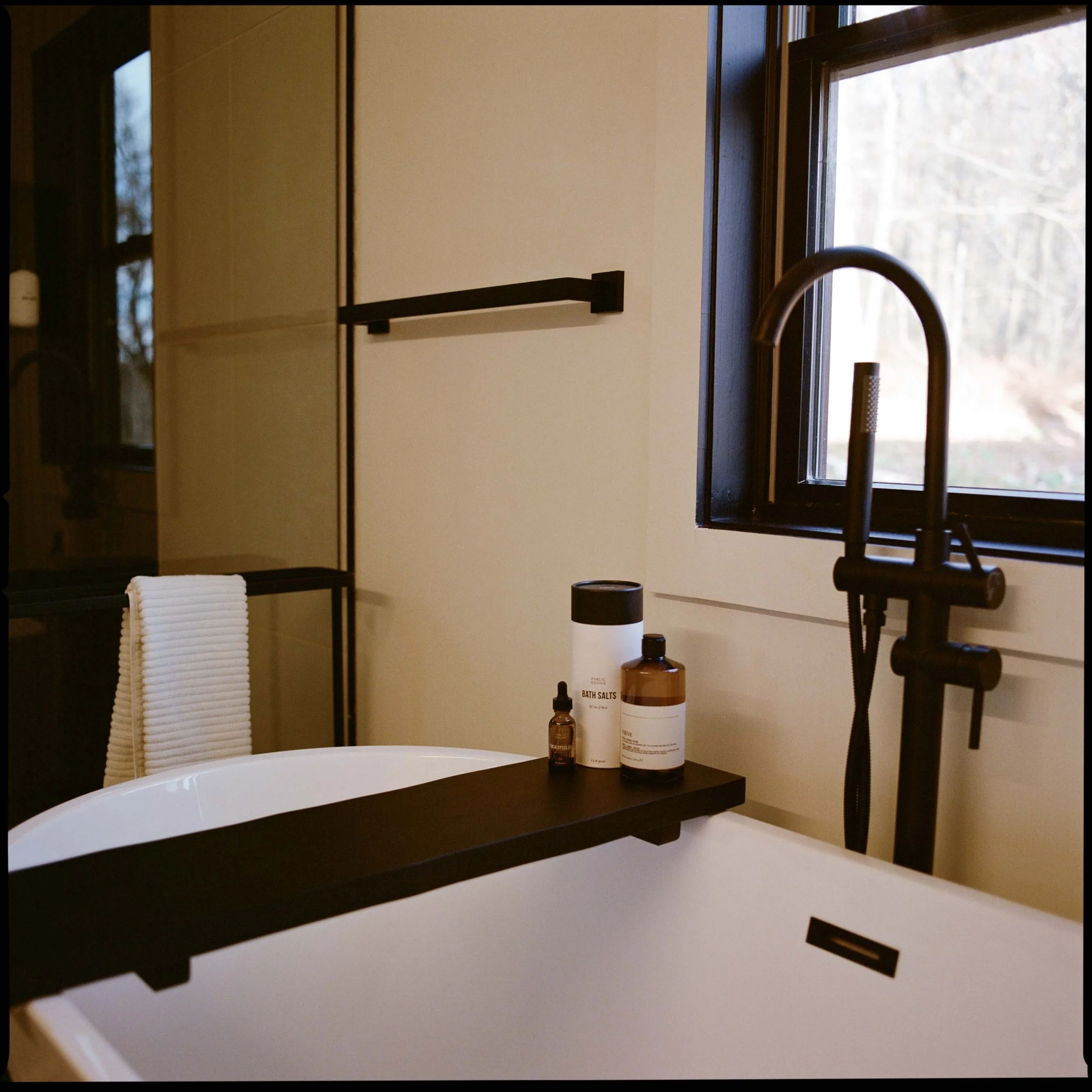 Soaking tub at The Glove with a window to the trees
