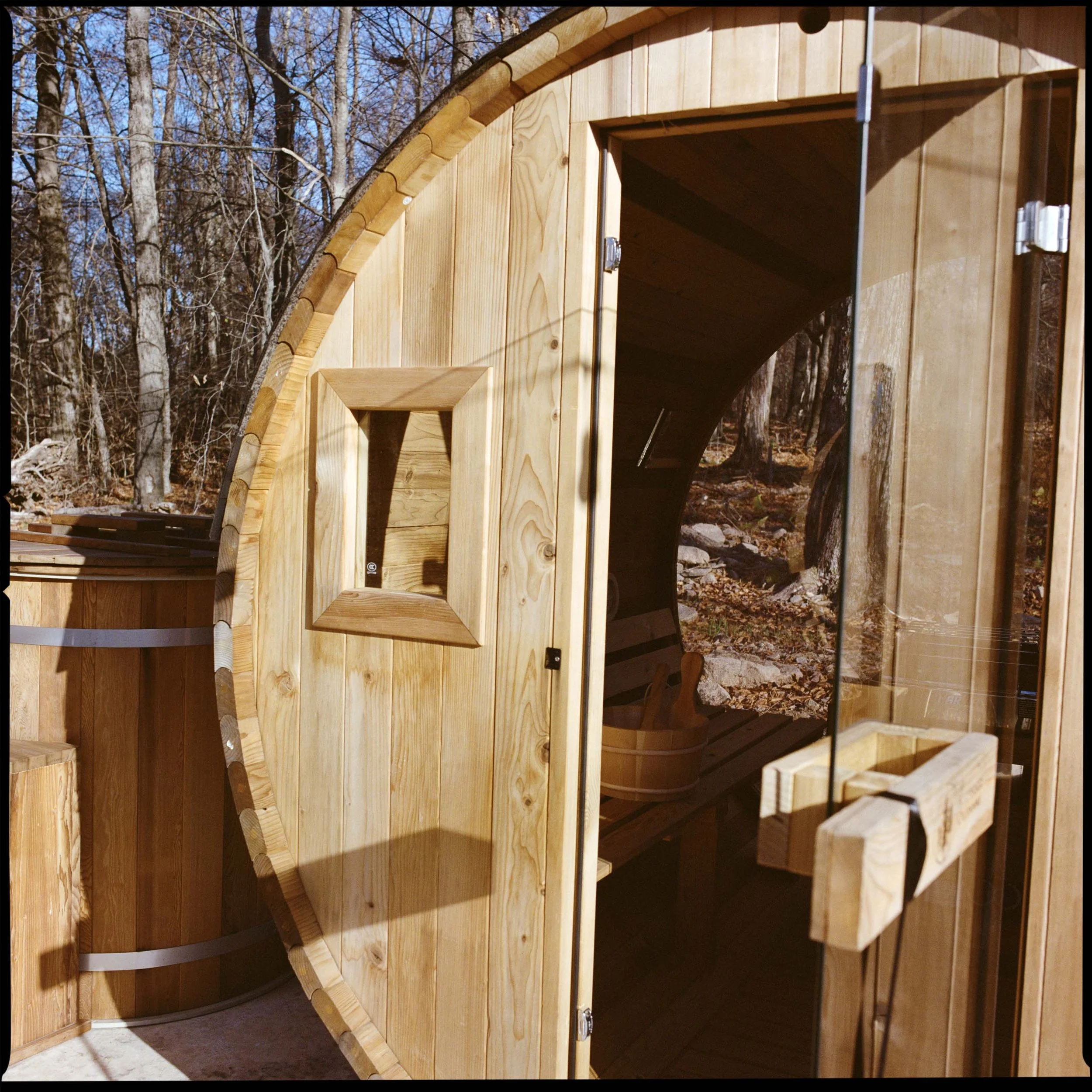 Cold plunge beside the barrel sauna at The Glove