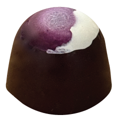 A dome-shaped dark chocolate bonbon with a glossy finish, topped with a hand-painted design in deep purple fading into white.