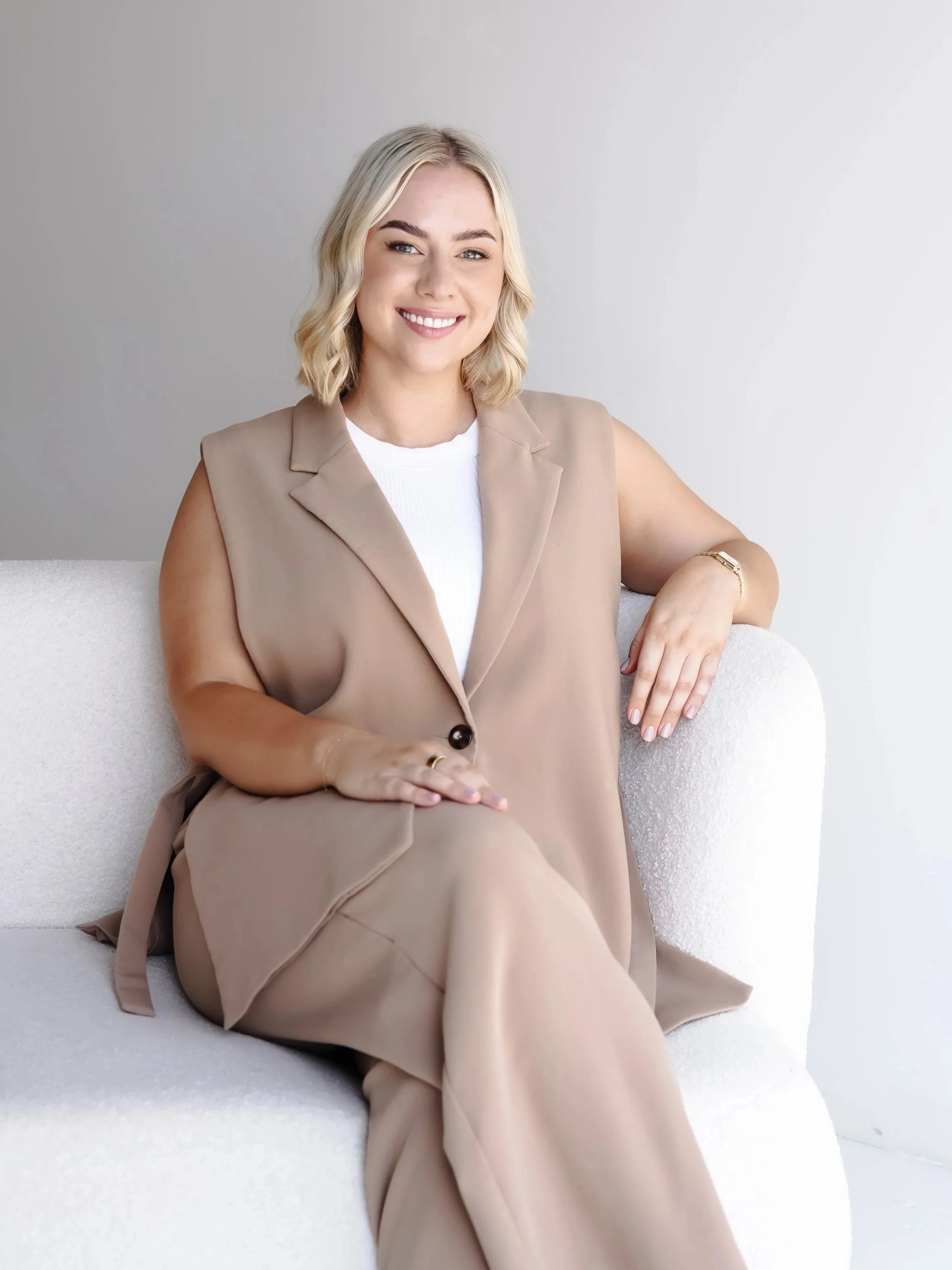 Natasha Rodgers, Clinical Psychologist, smiling warmly in a professional setting, symbolising her compassionate and approachable nature in therapy