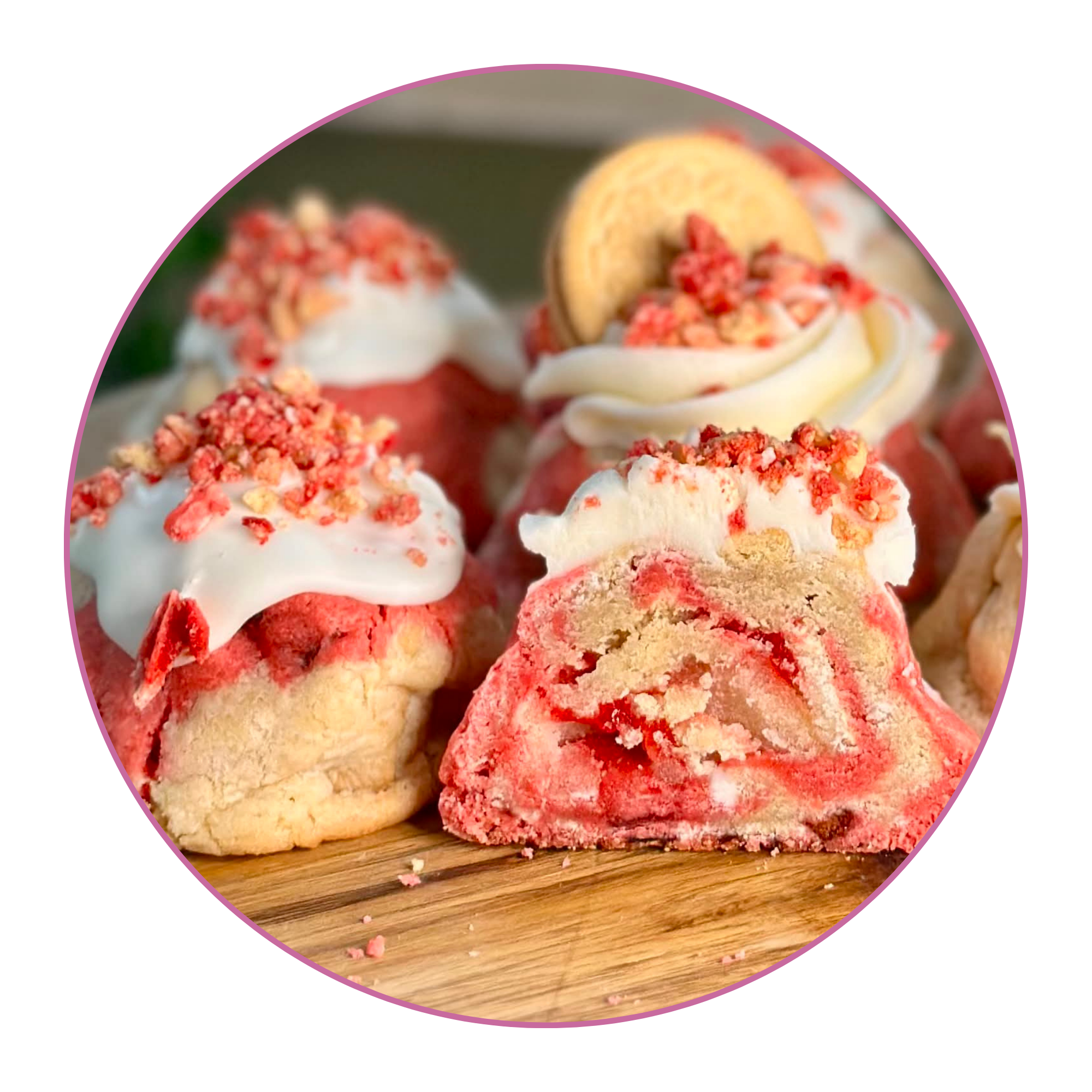 A plate of various decorated sugar cookies on a wooden surface.