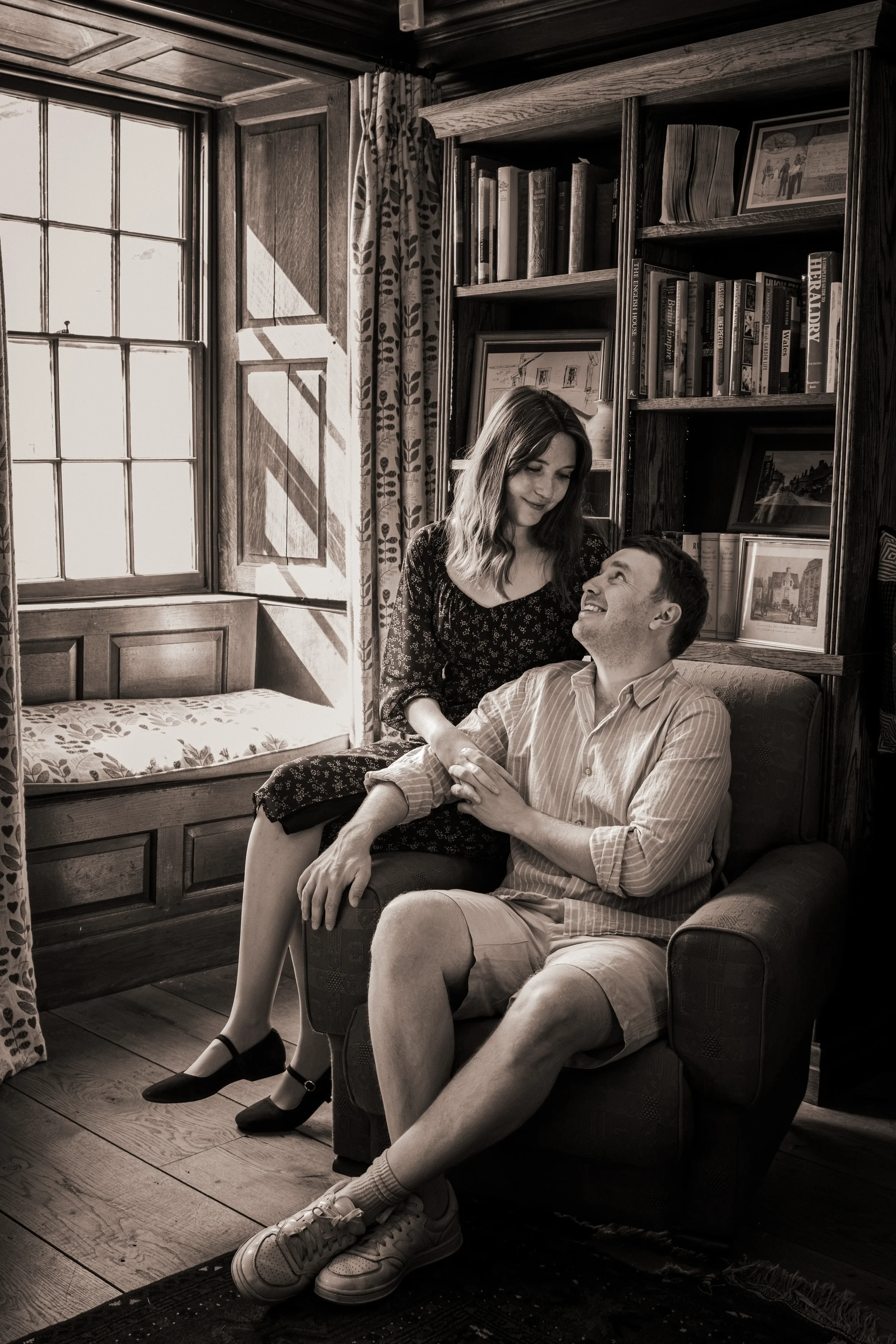 couple-sit-in-armchair-quirky-couple-photography-nant-clwyd-y-dre-ruthin-north-wales.webp