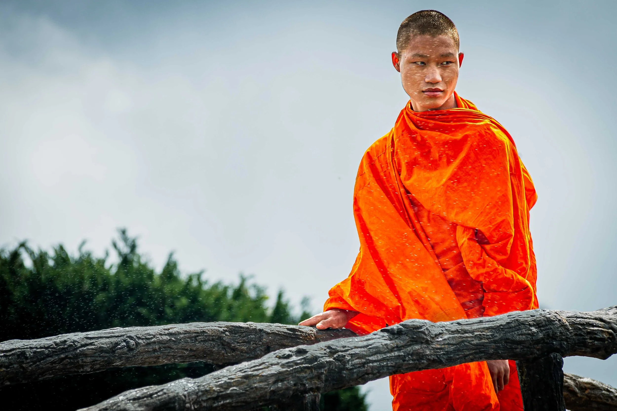 A monk gazes at the water fountain at Doi Inthanon, Northern Thailand.