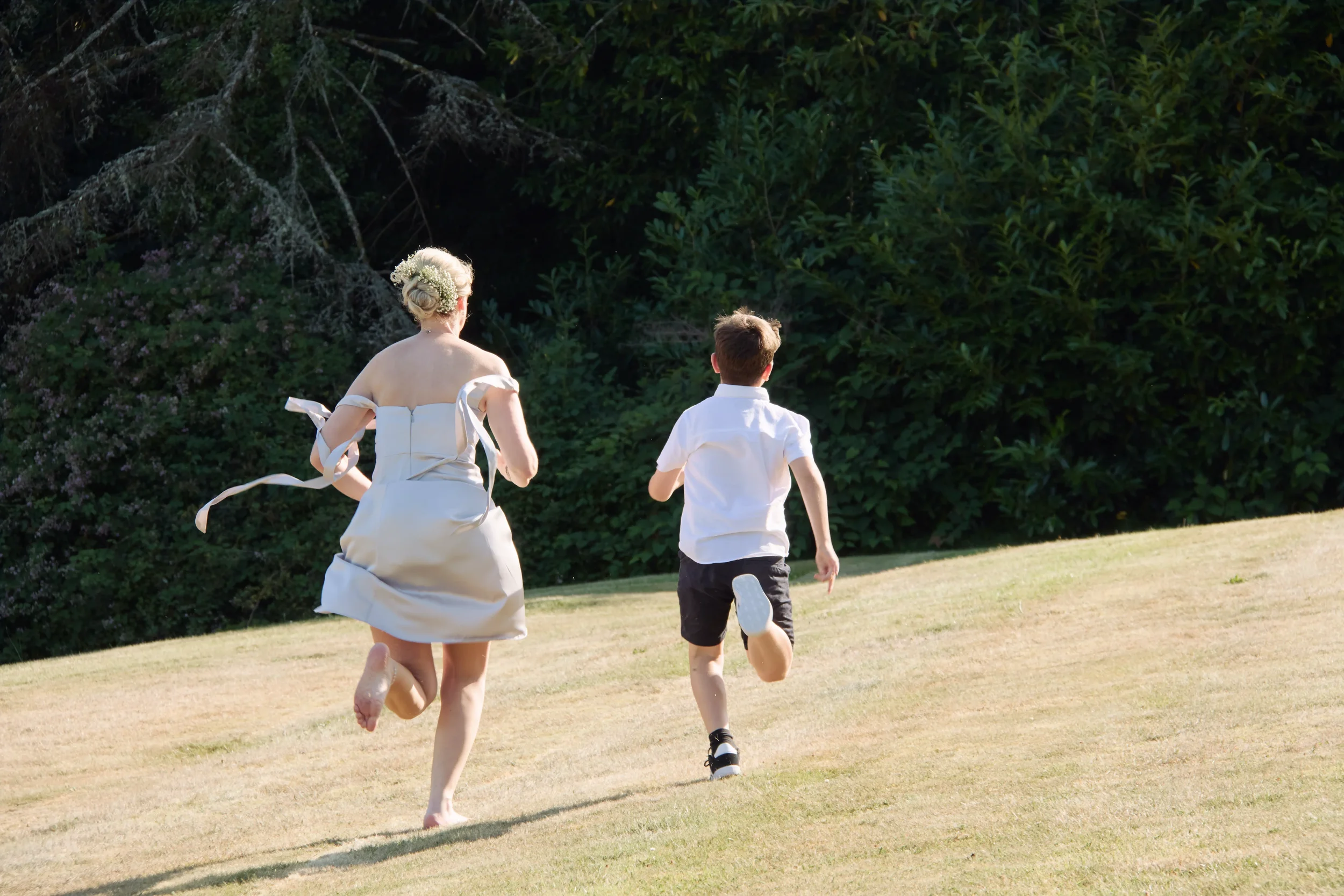 bridesmaid-races-child-talhenbont-hall-wedding.webp