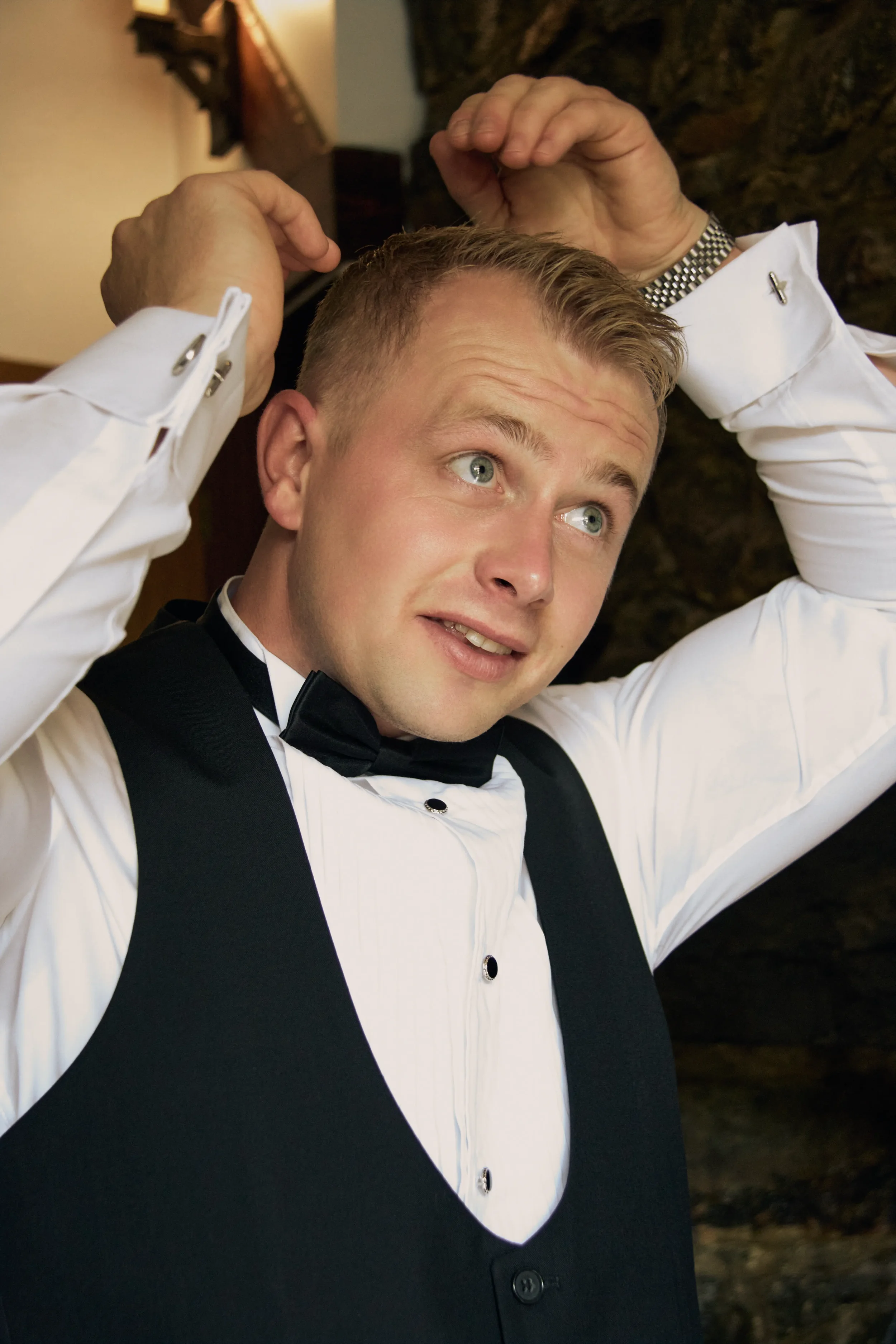 groom-prepping-hair-talhenbont-hall-wedding.webp