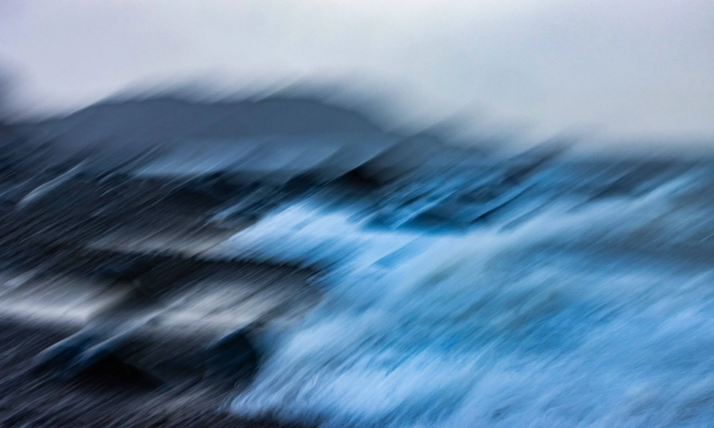 Blue Tempest: The angry storm waves batter the beach at Criccieth.