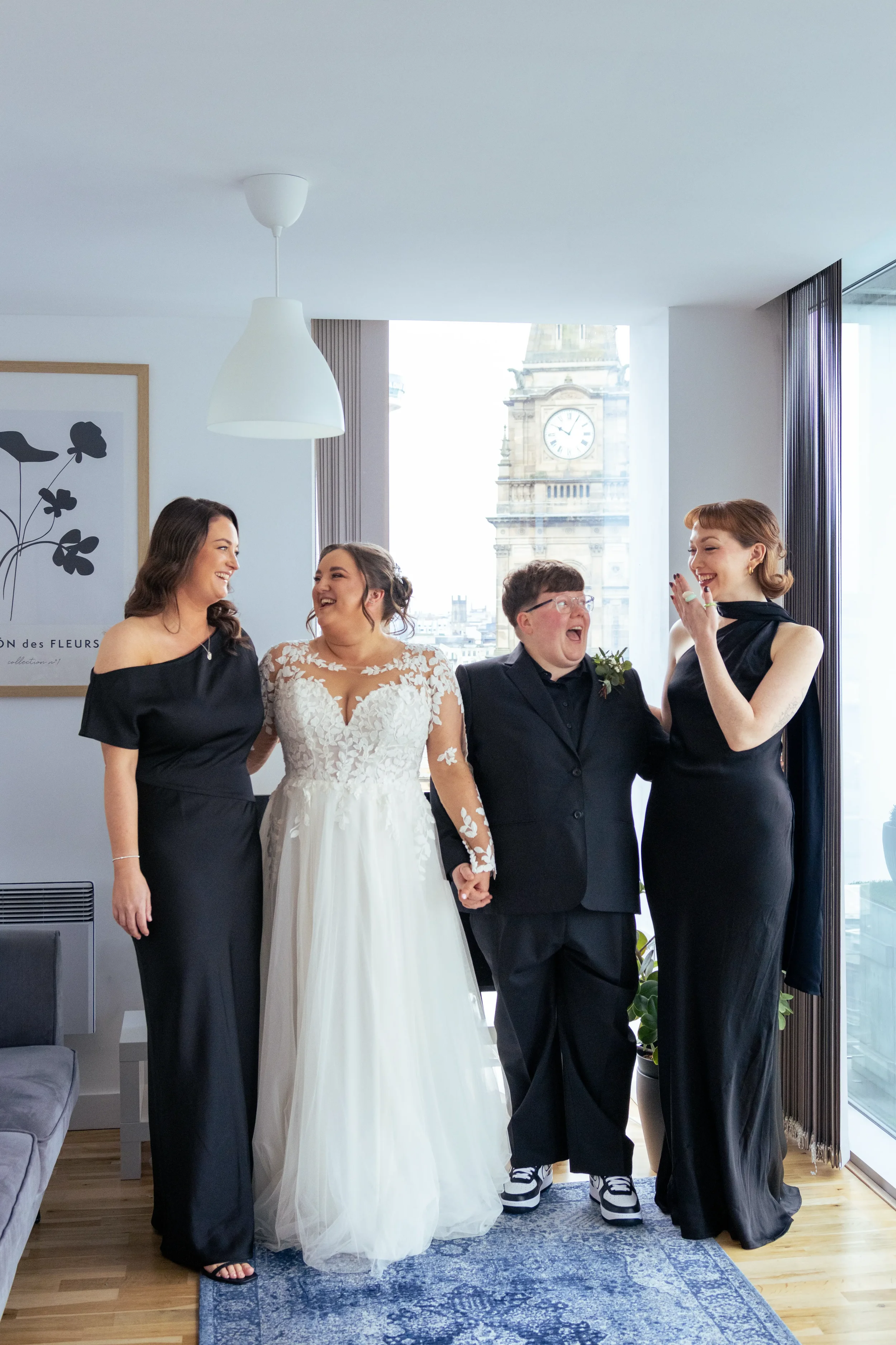 queer brides and bridal party at getting ready venue.webp
