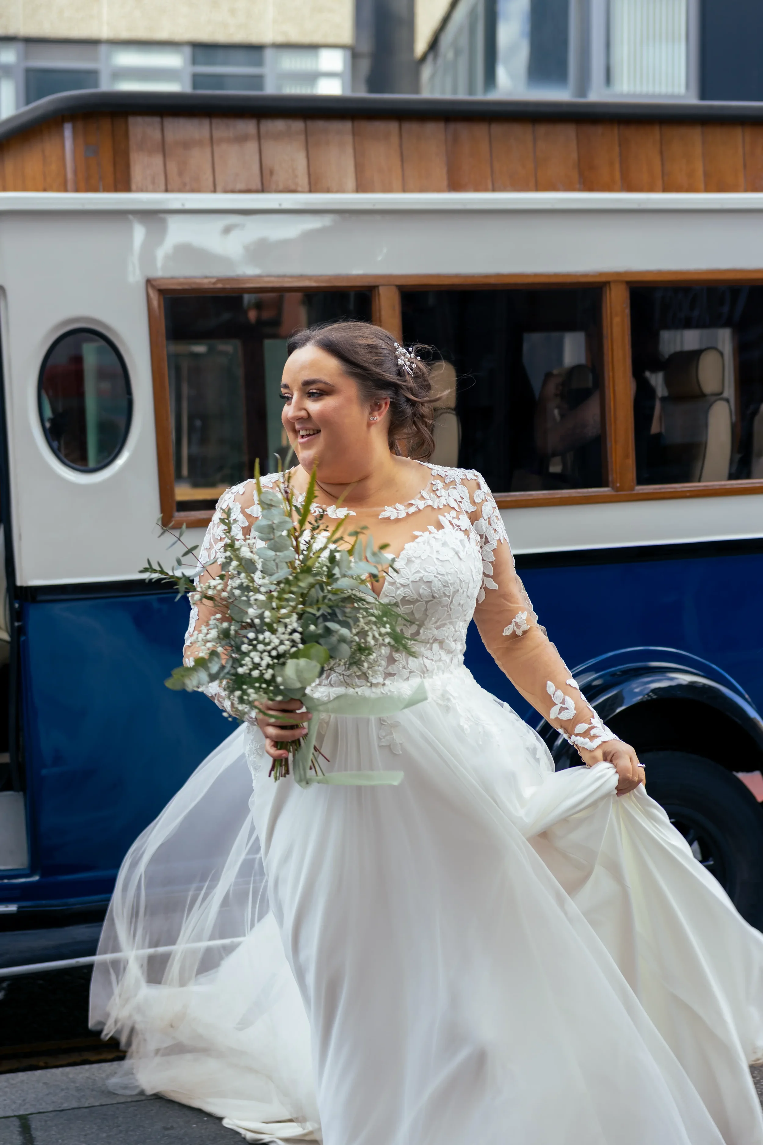 bride in dress exiting wedding vehicle.webp