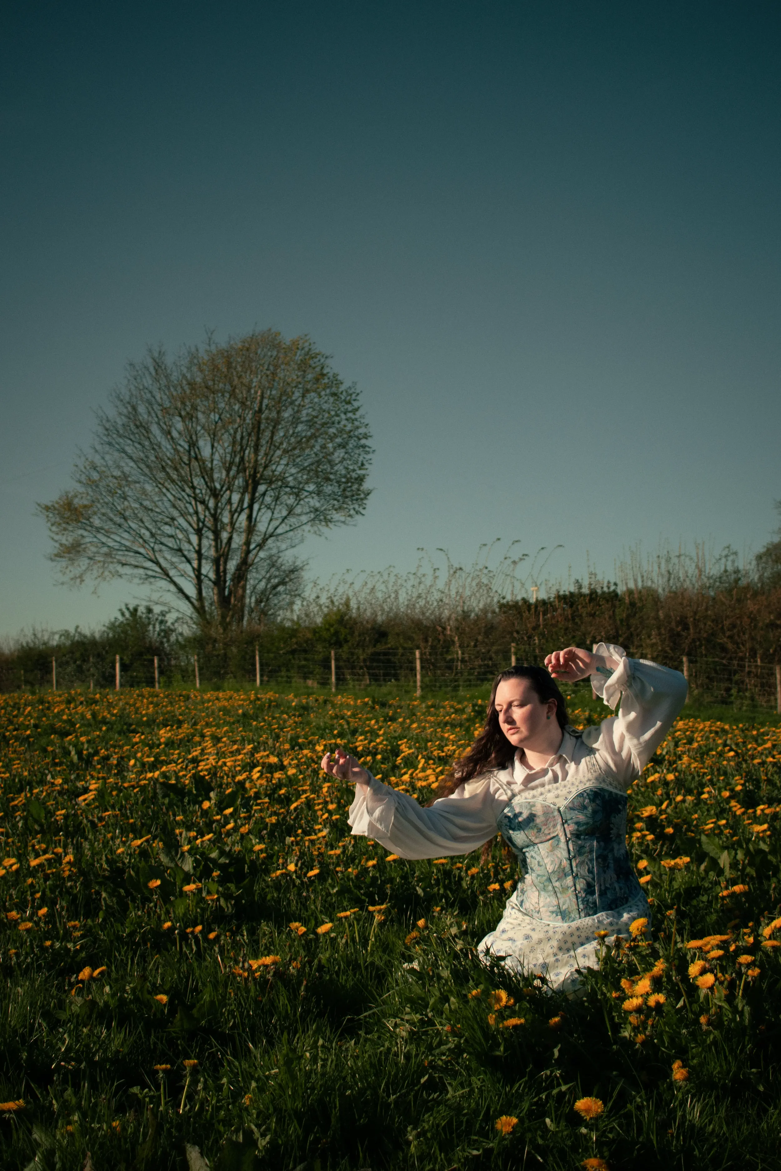 dandelion-field-whimsical-portrait-lady-in-blue-dress-north-wales-1.webp