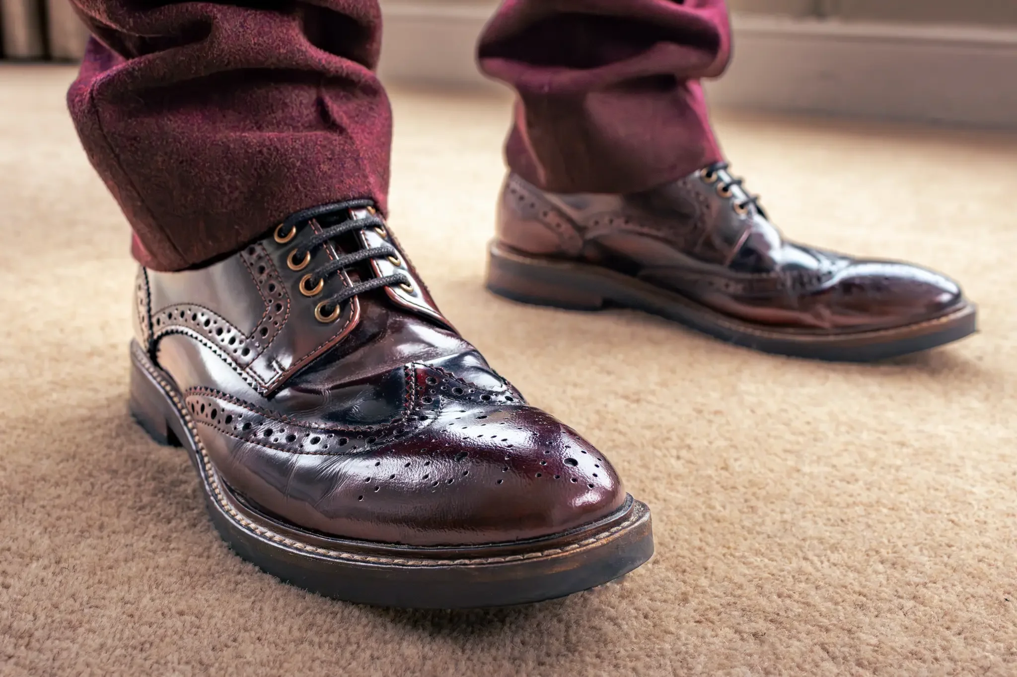 north wales wedding photographer close up shot of the bride burgundy red brogues.webp