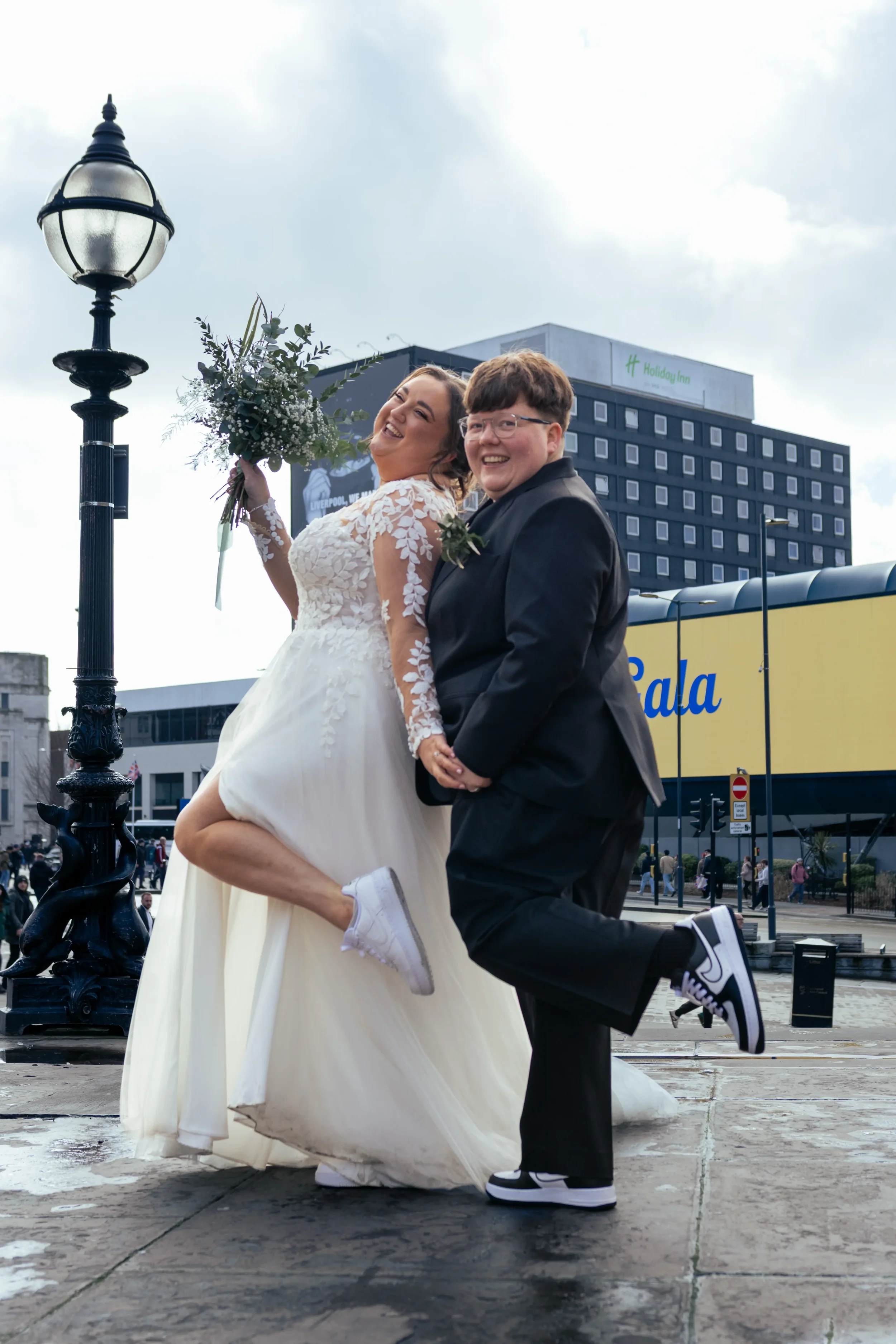 queer brides showing off footwear.webp