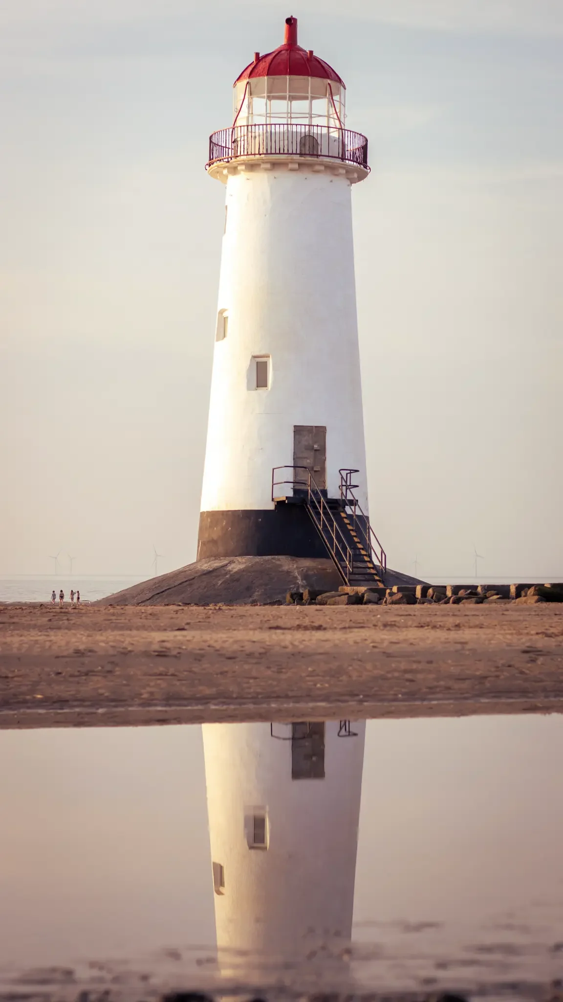 talacre lighthouse with reflection in water.webp