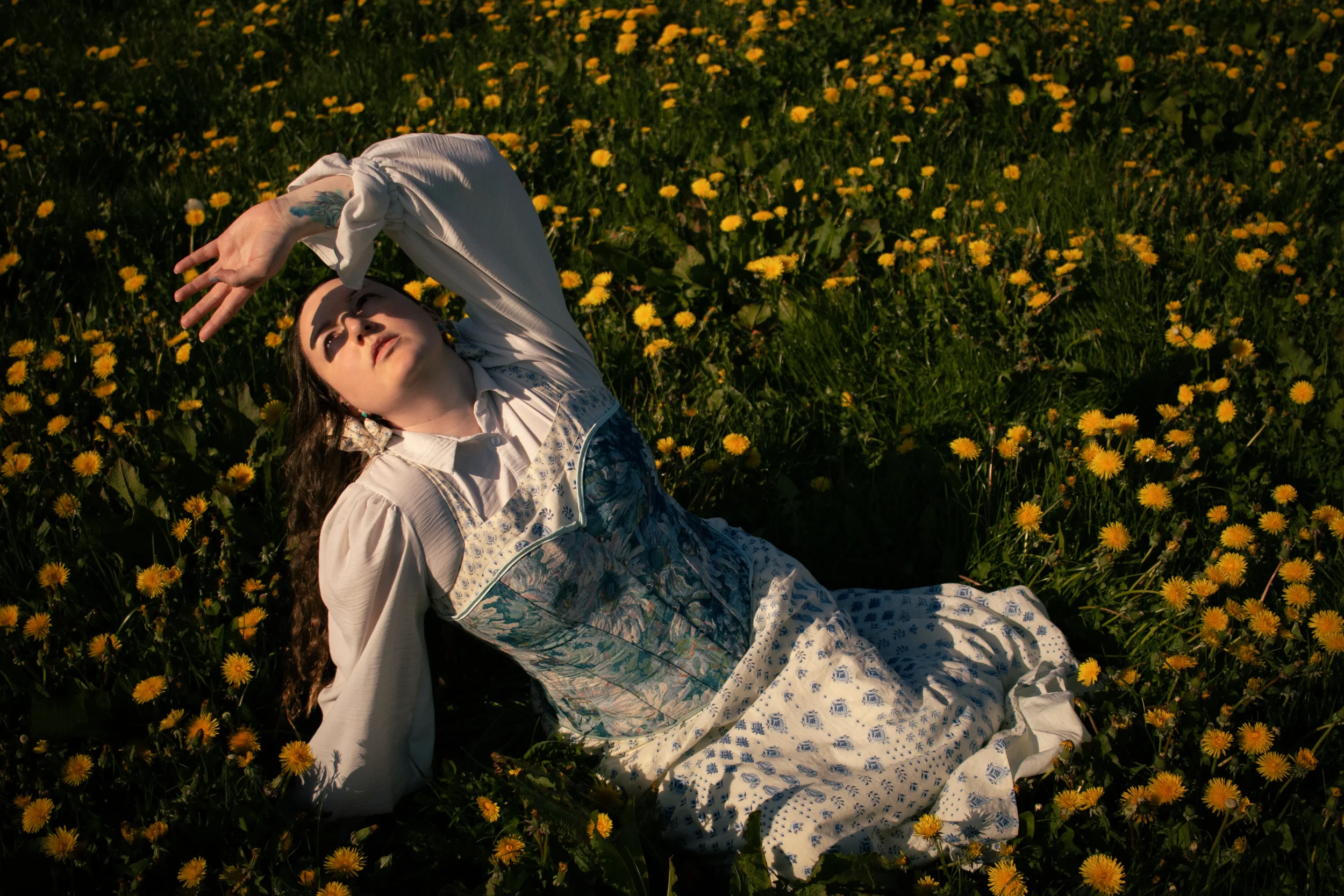dandelion-field-whimsical-portrait-lady-in-blue-dress-north-wales.webp