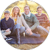 Family sitting on a blanket outdoors