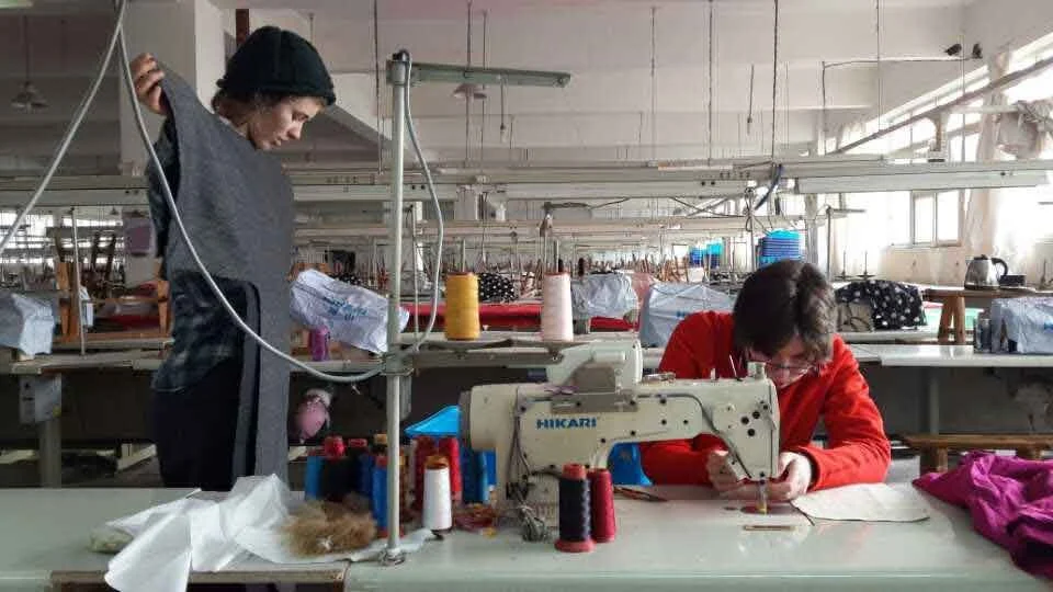 Putney School students making their own garments at a clothing factory in Chongqing, an artistic immersion project guided by Mentor Le Xi (奚乐).