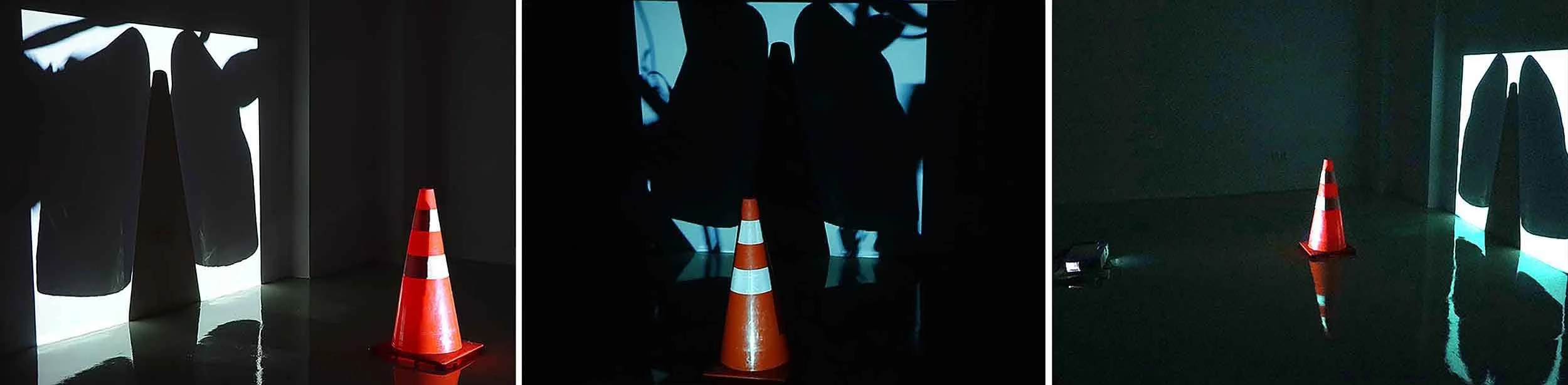 Three selected frames from the hybrid media installation artwork Organ (Year) by Le Xi, showing a physical traffic cone obstructing projected light to create negative shadow fields.