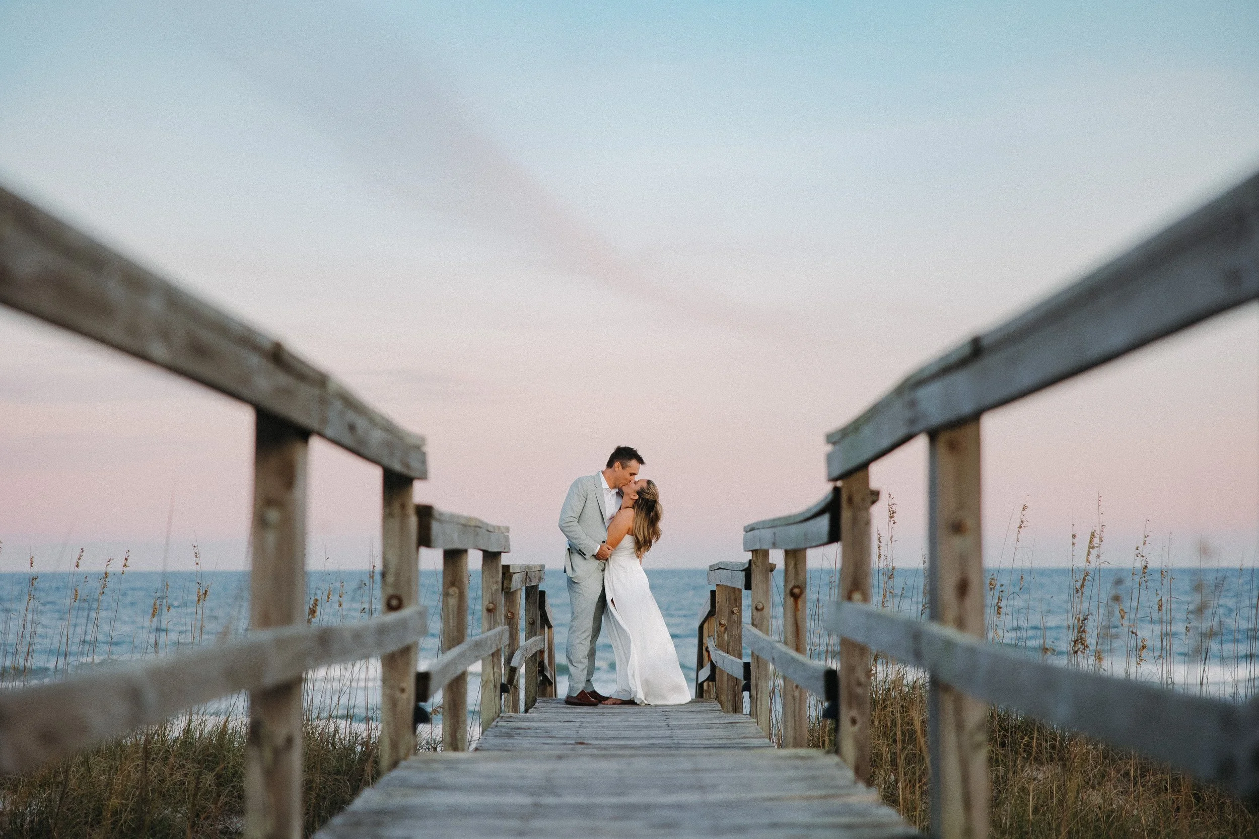 beach wedding sunset kiss carolina beach nc.jpg