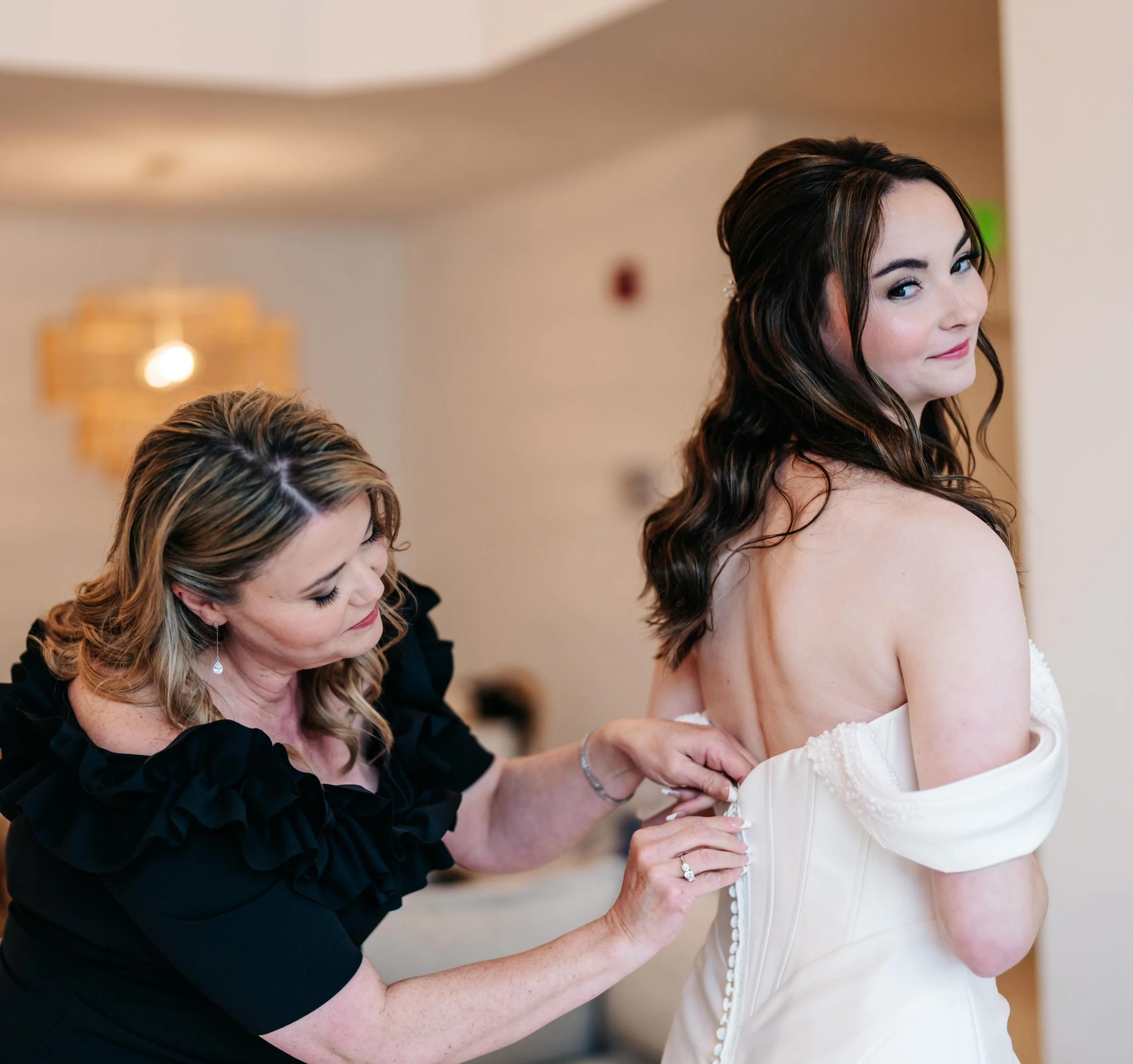 One of my favorite moments on a wedding day 🤍

The quiet seconds when the dress is finally zipped, the emotions start to settle in, and it suddenly feels real.

For the bride, it&rsquo;s the moment she truly feels like a bride.

For mom, it&rsquo;s 
