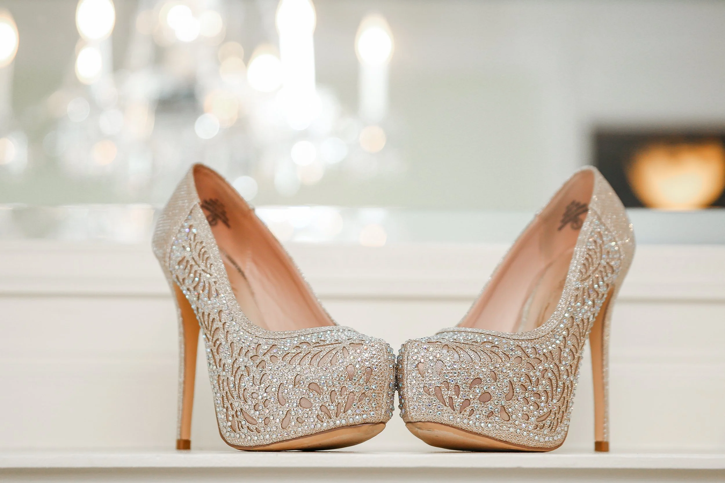Minnesota based photographer, LKW Photography, loves to photograph details  like this pair of elegant high-heeled shoes decorated with glittering rhinestones and intricate cutout patterns.