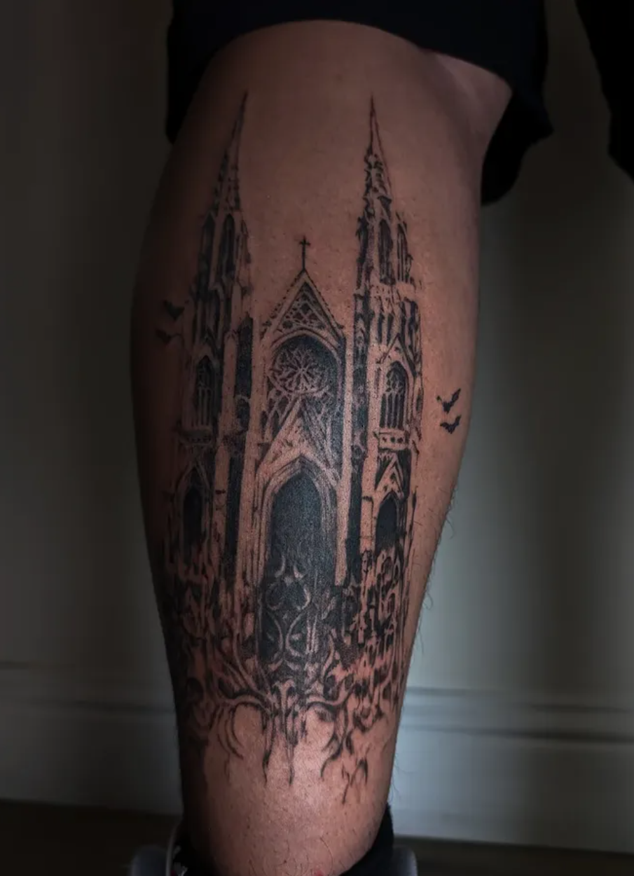 A symmetrical, intricate line drawing of a dragonfly with detailed, elongated wings on a technical grid background.