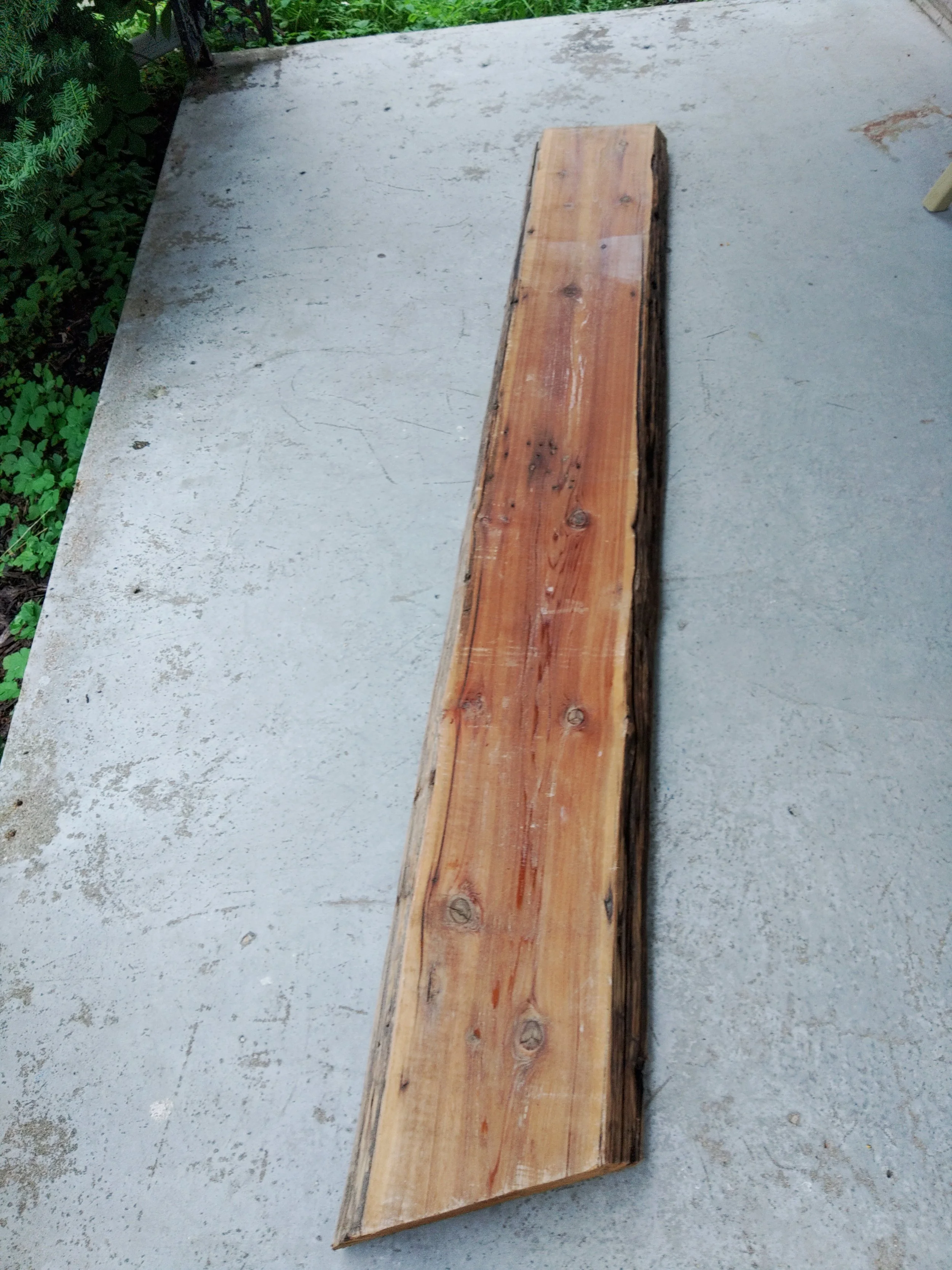 This was a section out of a telephone pole.
It became a fireplace mantle. What was left might become 2 bedside tables. We shall have to see that is best for the pieces.