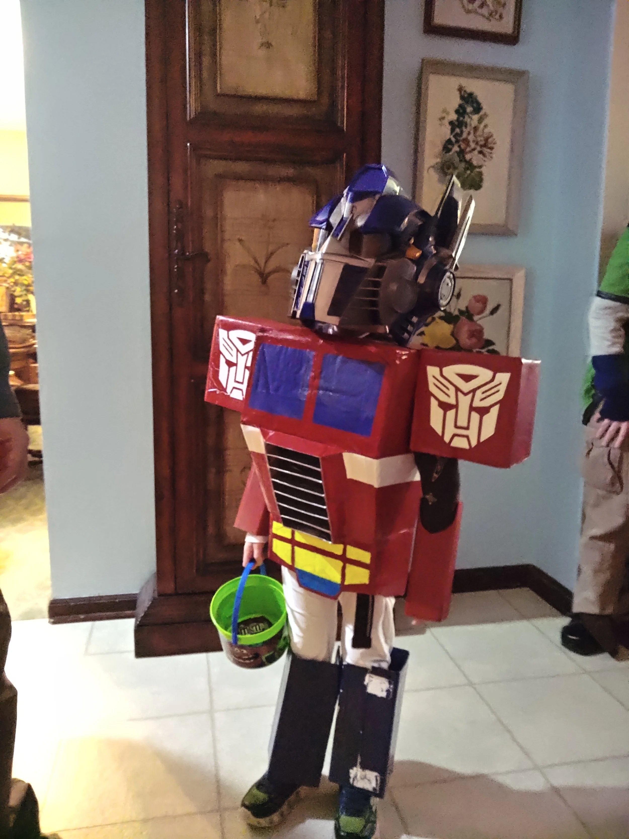 For painted cardboard, this turned out pretty good. there are a few things I would improve. Like an option to make it warmer. that was an extra cold Halloween. It did get him a full size candy bar at one of the houses he went to.