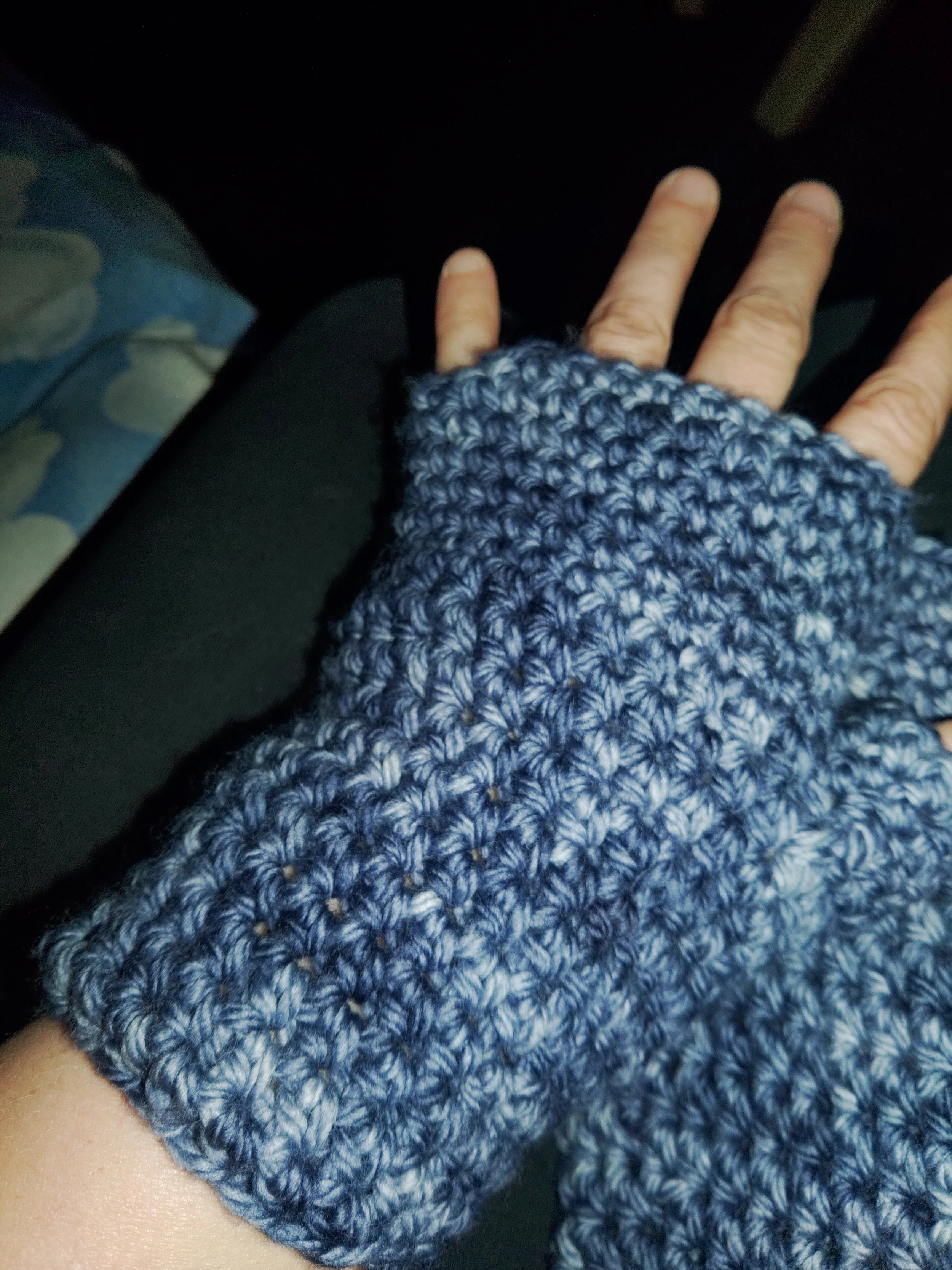 finger-less gloves crocheted from yarn bought from Sneaky Dog Fiber company. They do custom hand dyed yarn and yarn crafts.