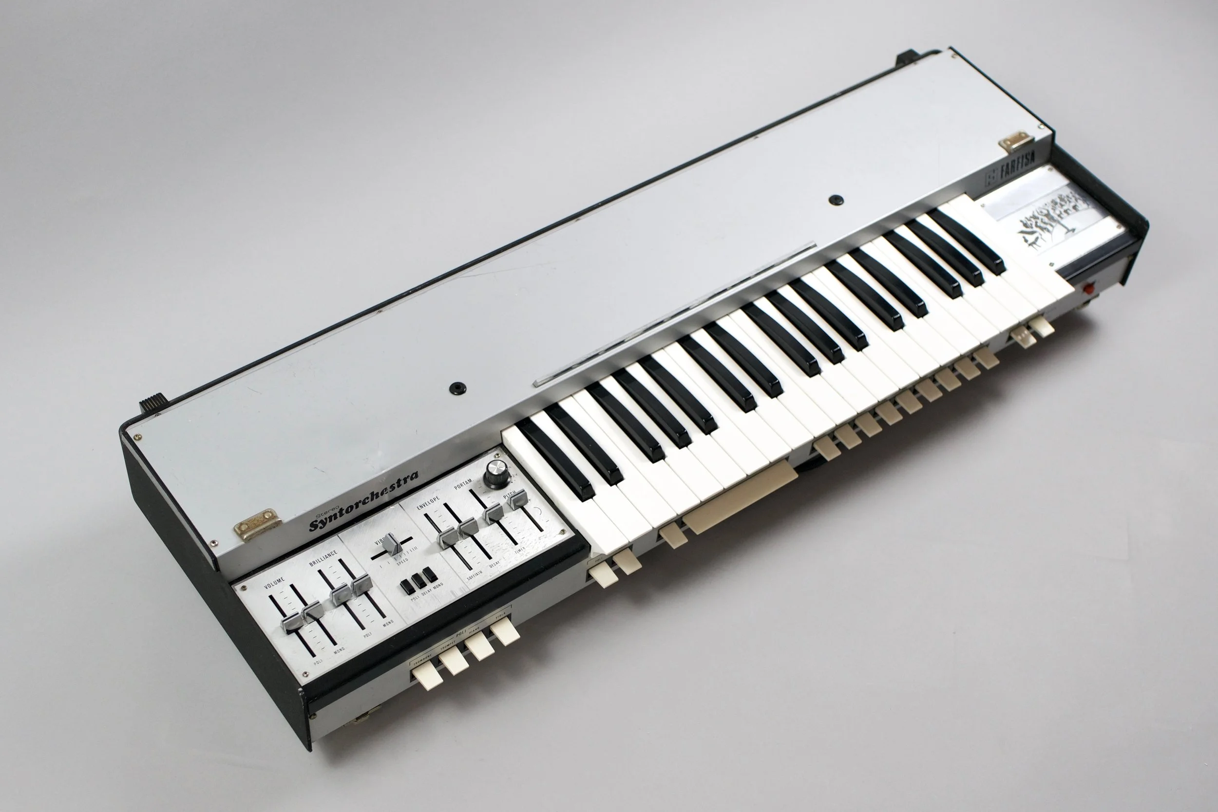 The polyphonic presets do have separate brilliance and vibrato controls while the monophonic presets have attack and decay as well as a filter section with LFO applicable to the VCA or VCF - the speed is set with the vibrato control. 
Speaking of the