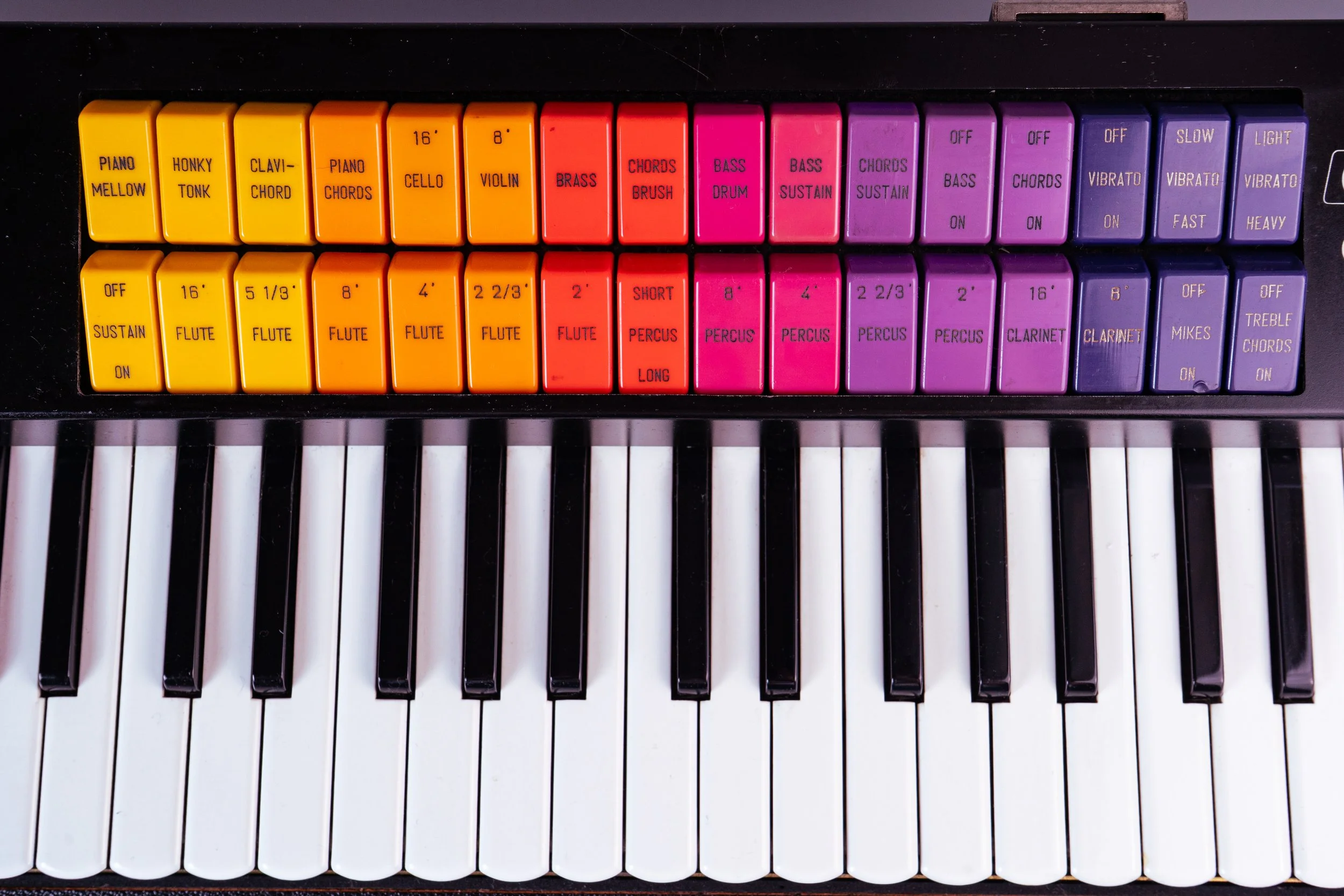 Cute like a button, or rather rocker switch. There are 5 instrument sections on board : Organ with percussive sounds and 2 clarinet presets, a String machine, a Brass machine with filter controls, left hand bass, chord and piano presets as well as tw