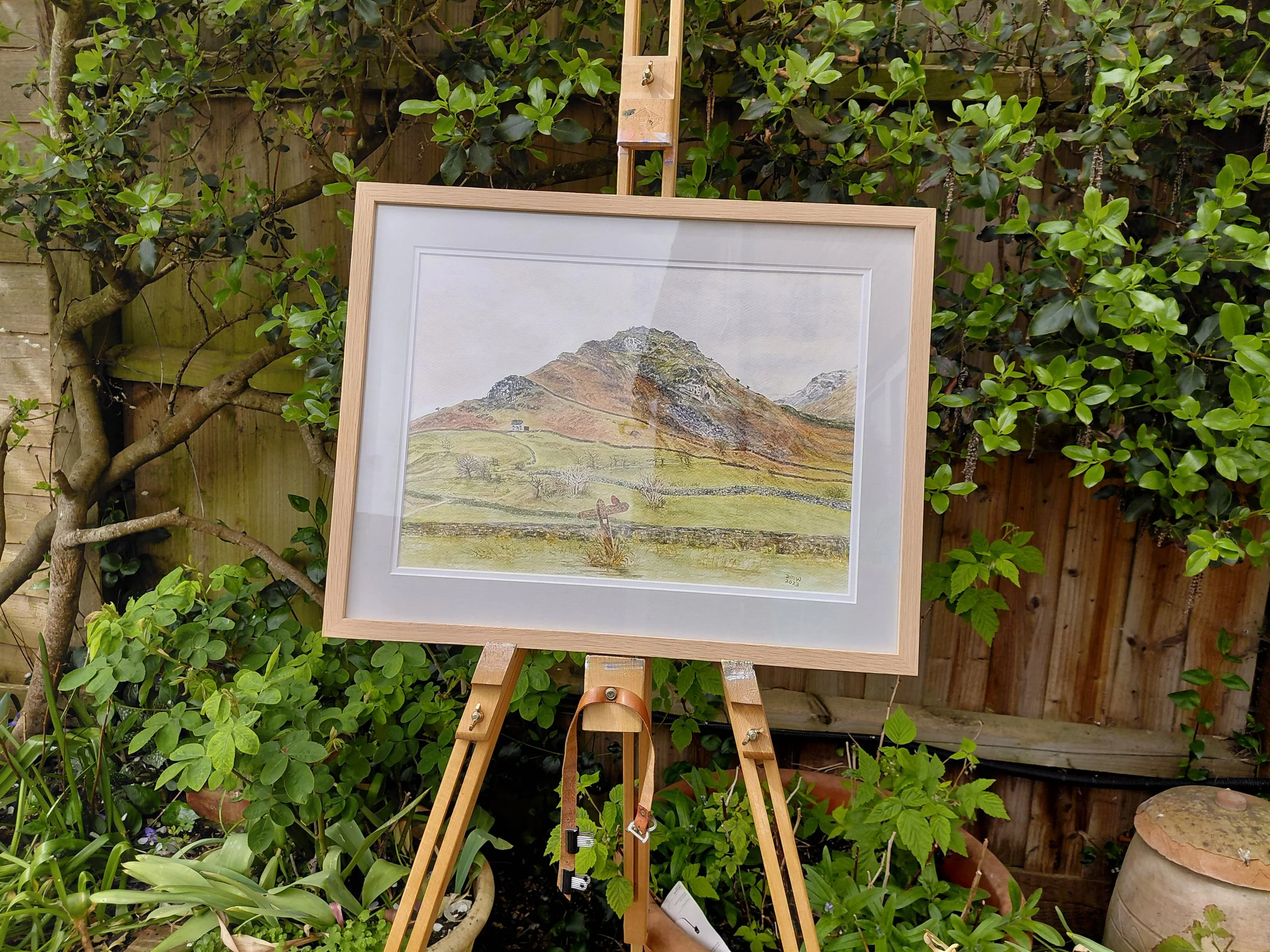 Cumbria Signpost Series 2 - Walls. Watercolour, 15 x 18.5”, finished size. Framed: light wood with grey mount